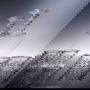 6pc Waterford Crystal Tableware: Knife Rest, Salt Cellars & Napkin Rings: An elegant set of six Waterford crystal table accessories, comprising four napkin rings and two knife rests. The napkin rings are crafted in a mix of round and oval forms, each featuring the iconic cr