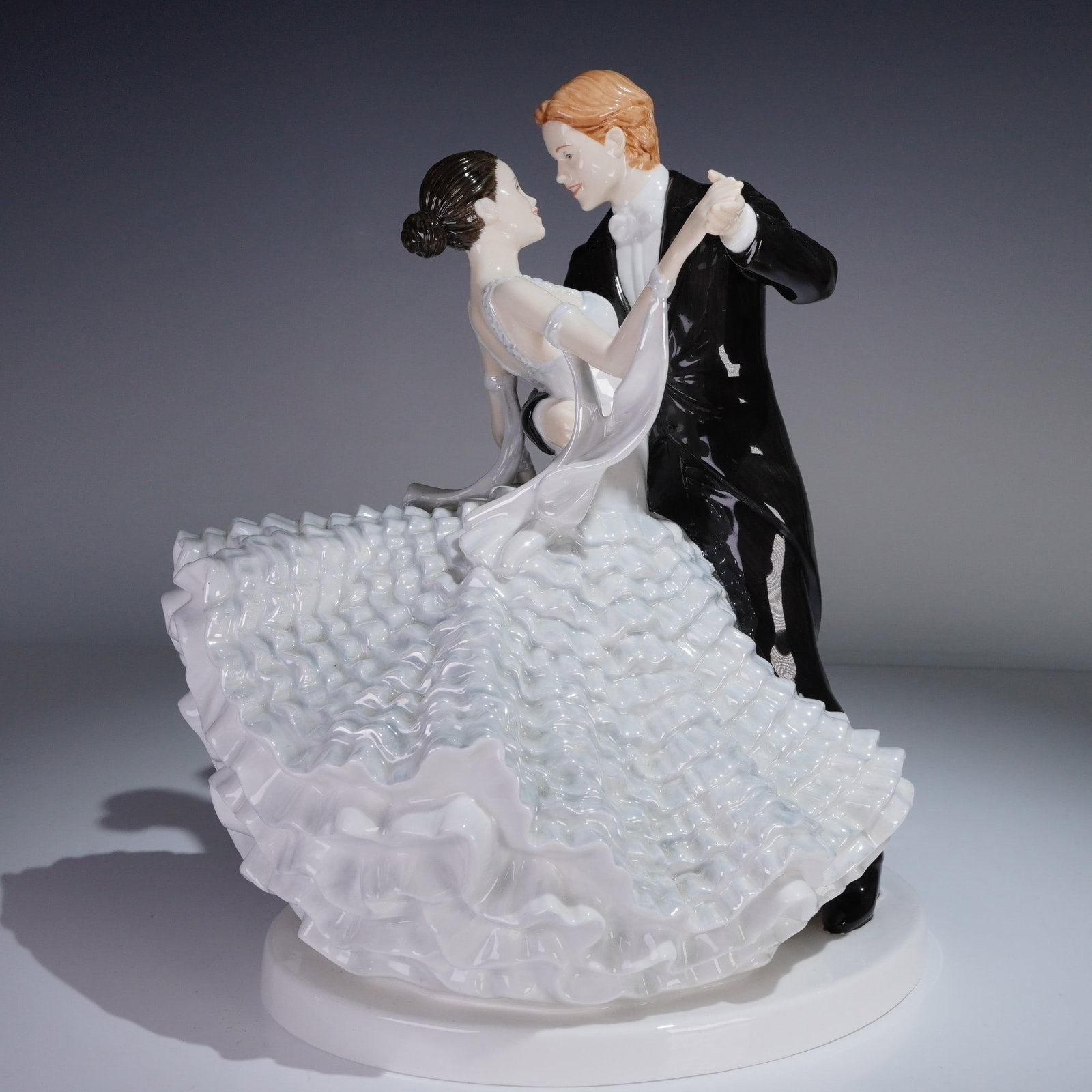 Royal Doulton Figurine The Slow Waltz HN5444 with Box Signed: Royal Doulton fine bone china figurine titled The Slow Waltz HN5444 from the Dance series, depicting a couple mid-waltz in formal evening wear. Hand made and hand decorated, this piece features intric