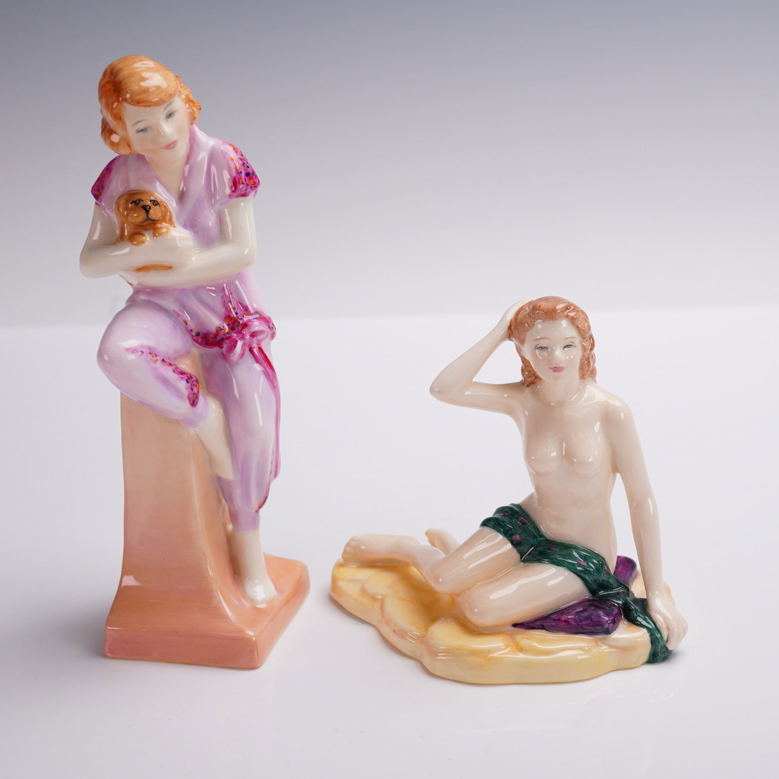 2pc Royal Doulton Figurines, Lido Lady HN4247 & Summer's Darling HN4401: A charming pair of hand-made and hand-decorated bone china figurines from Royal Doulton's Archives collections. The first is Lido Lady, HN4247, from the Lesley Harradine Collection, modeled in a soft 