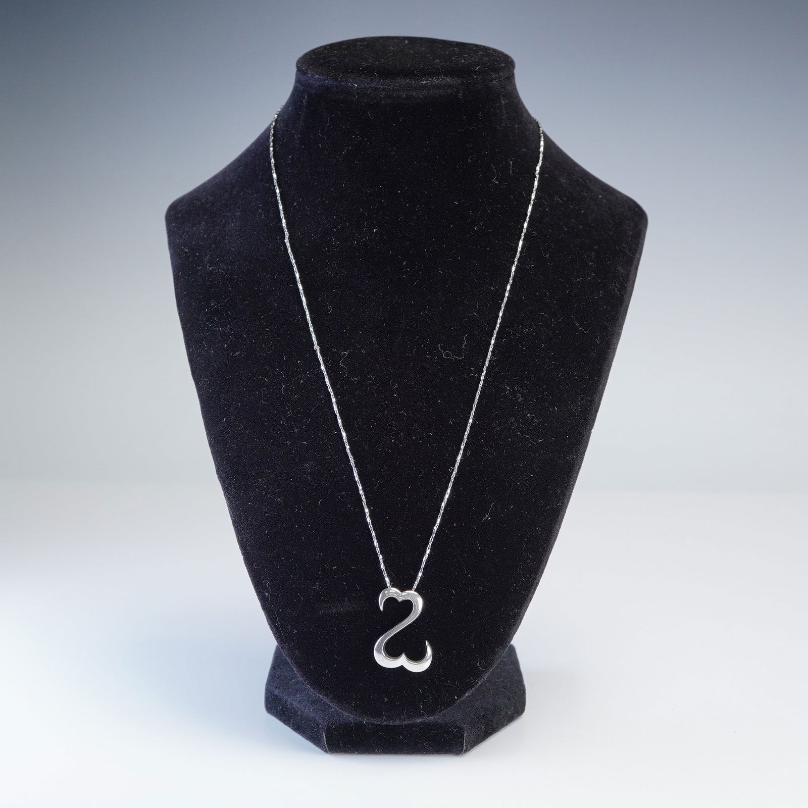 2pc Sterling Jane Seymour Open Heart Pendant Necklace: 2-piece necklace set featuring the iconic Jane Seymour Open Heart pendant in sterling silver, marked 925 and weighing over 4 grams. The sculptural charm is suspended from a fine 20-inch chain marked 1