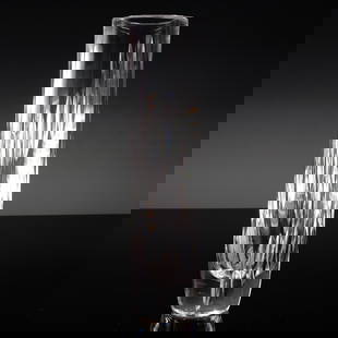 Cut Crystal Vase, Etched Ceskci Signature: This clear cut crystal vase features a sleek cylindrical form with deep vertical faceting that catches and refracts light beautifully. The base is etched with Ceskci, suggesting Czech origin, though t