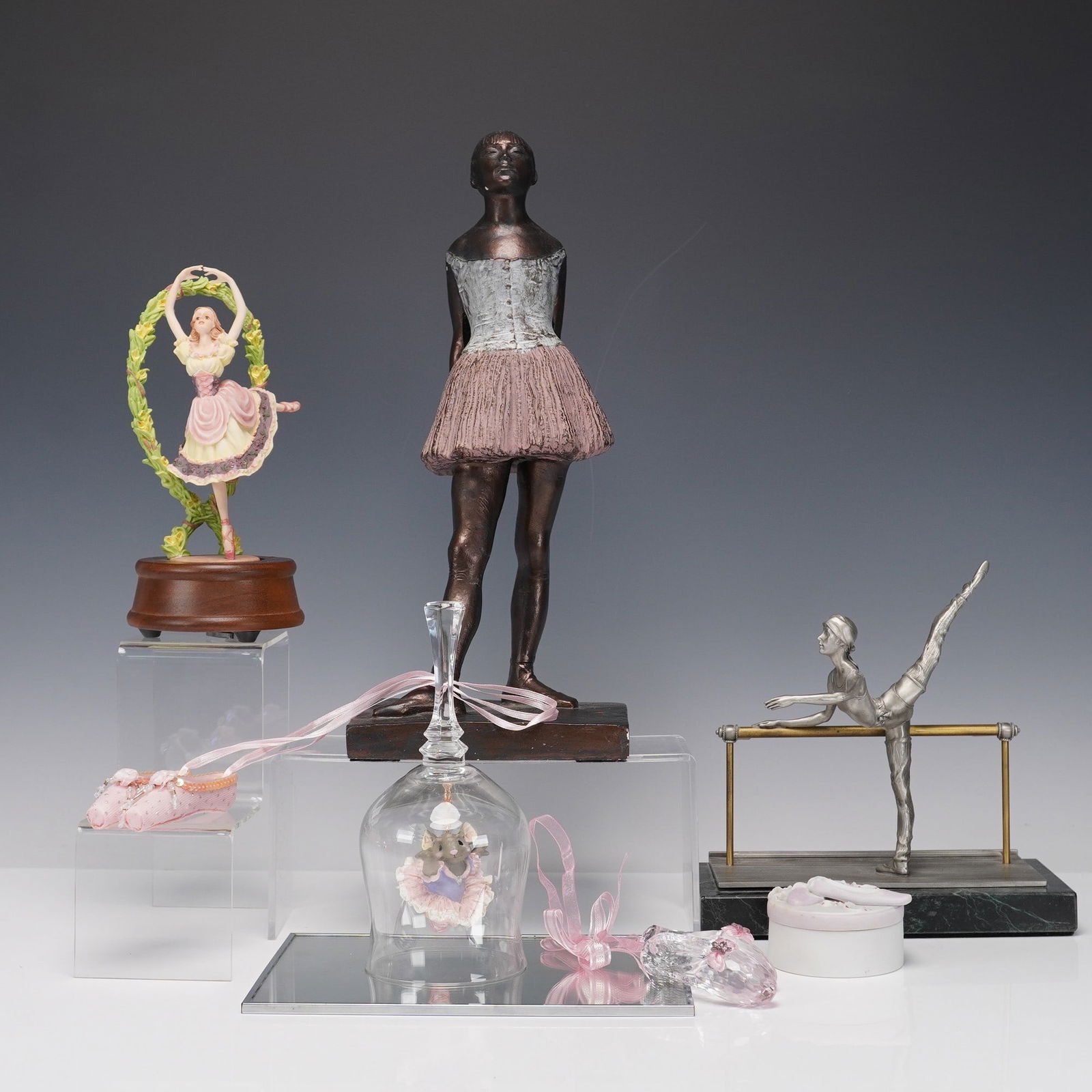 8pc Ballet Figurines, Ornaments & Keepsakes: Group of eight ballet themed decorative pieces including a figure after Edgar Degas' Little Dancer, Aged Fourteen, signed by S. Eylanbekov and produced by Alva Studios. Also included are a pewter ball