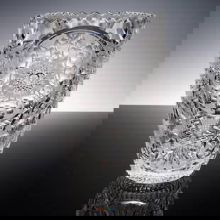 Cut Crystal Vase with Starburst and Oval Panels: Showcasing intricate craftsmanship, this striking cut crystal vase is adorned with elaborate starburst medallions framed by rounded thumbprint ovals and arched fan panels. The precision of its wheel-c