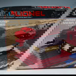 Lionel Diesel Horn Sound Shed 6-12903 with Original Packaging: Lionel Diesel Horn Sound Shed, catalog number 6-12903, designed for O and O-27 gauge train layouts. This sound accessory replicates the realistic diesel horn blast when a train passes by. The unit is
