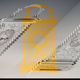 Imperial 24K Gold & Silver Plated Carriage Clock By Igor Carl Faberge: A luxurious Imperial carriage clock by Igor Carl Faberge for the Franklin Mint, crafted with 24k gold and silver plating and adorned with synthetic rubies. The rectangular case features beveled glass