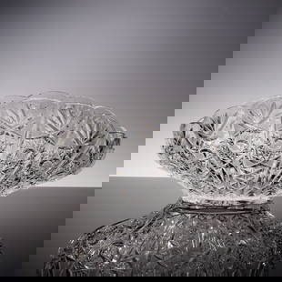 American Brilliant Cut Crystal Clam Shell Form Bowl: Sparkling American cut crystal bowl in the shape of a scalloped clam shell, expertly crafted with deeply cut hobstar, fan, and crosshatched motifs. The clear leaded crystal is richly detailed and high