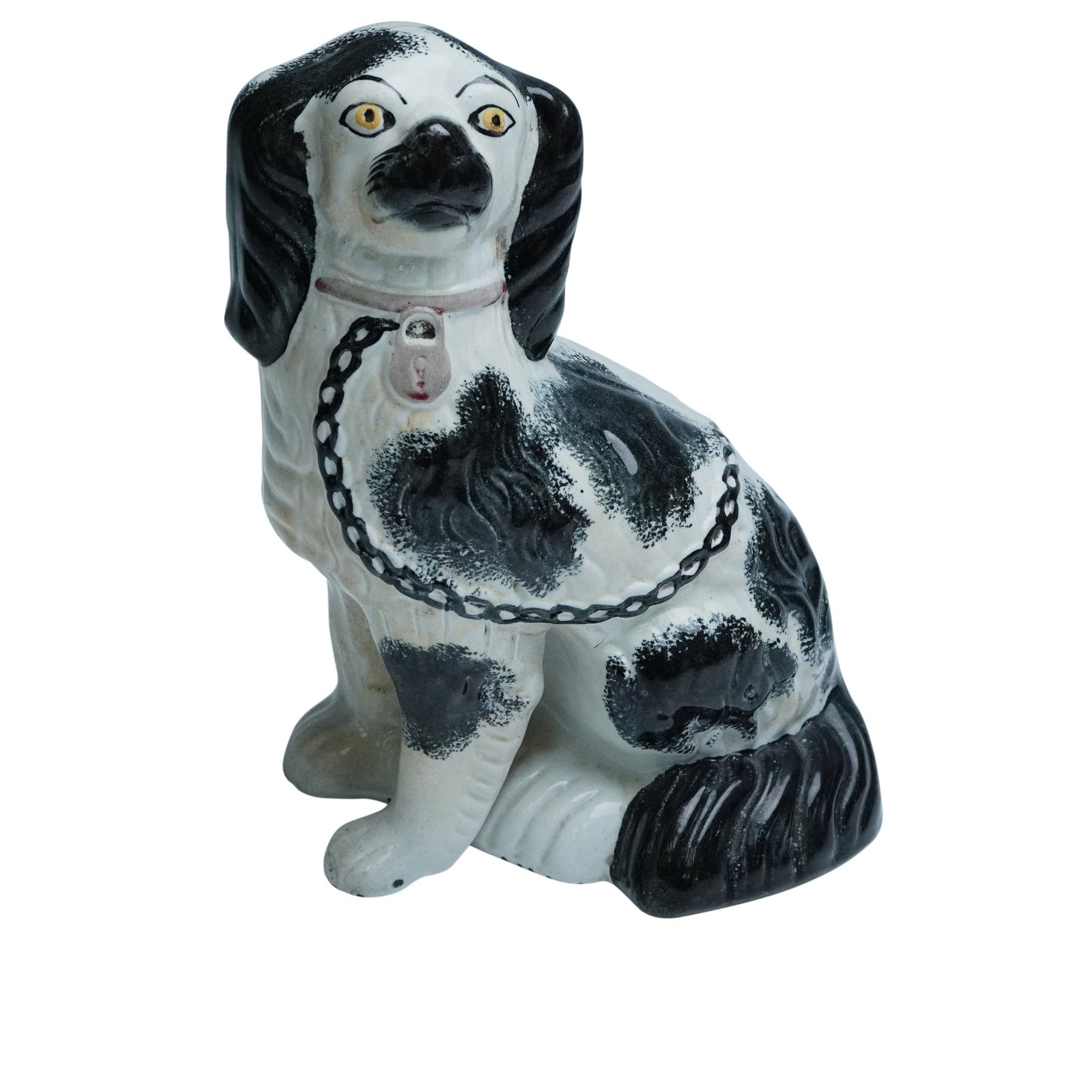 Staffordshire Black and White Spaniel Figurine: This striking Staffordshire black and white spaniel figurine features a proud seated pose with beautifully hand painted markings, bright expressive eyes, and a delicate collar and chain detail. The fl