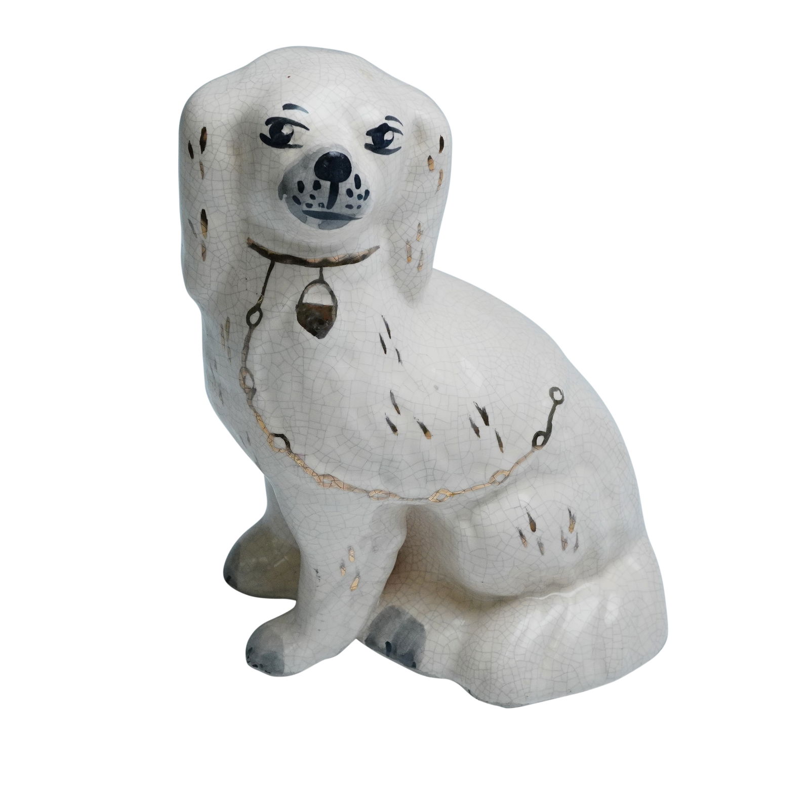 Staffordshire Spaniel Figurine: This charming Staffordshire spaniel figurine features a graceful seated pose with a delicate hand painted face, soft expressive eyes, and a fine chain and locket detail around its neck. The figure is