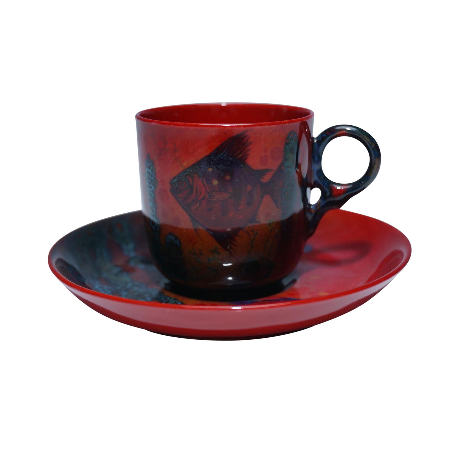 Royal Doulton Rare Flambe Sung Cup & Saucer w/ Fish Design: This exceptional Royal Doulton Flambe Sung cup and saucer set showcases the renowned artistry of Royal Doulton with its rich flambe glaze and distinctive fish design. The cup features an elegant red a
