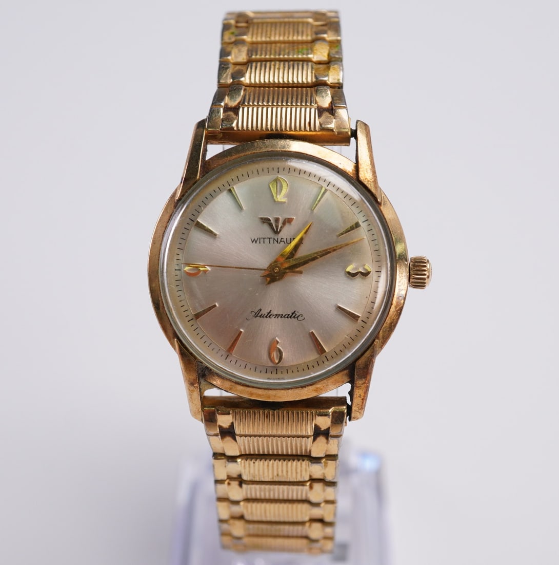 Wittnauer Automatic Watch Gold Filled Bezel Band: Wittnauer men's wristwatch with a silver-tone sunburst dial featuring gold-tone indices, hands, and Arabic numerals at 12, 3, 6, and 9. The automatic movement is set in a round case with a 14k gold fi