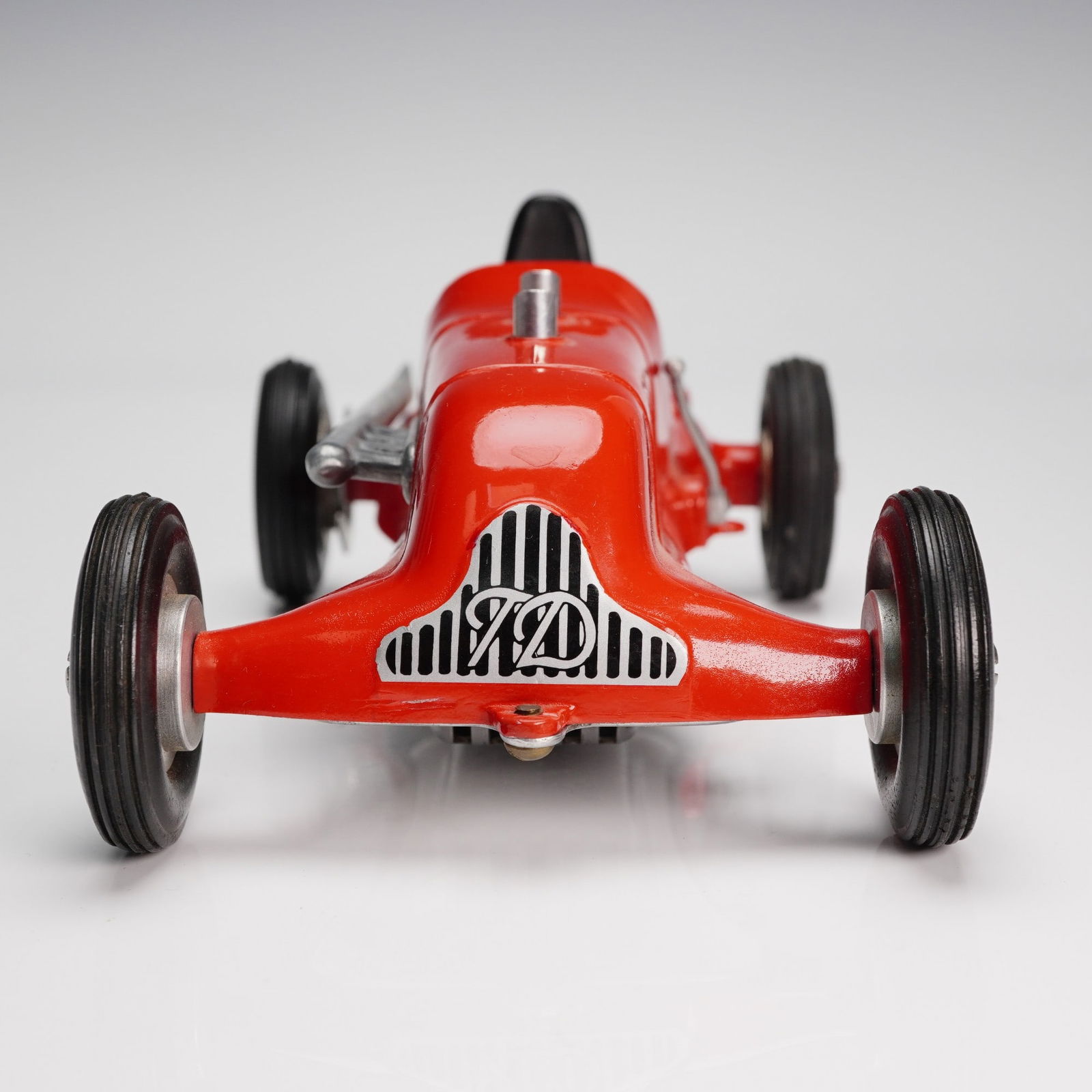 Roy Cox Thimble Drome Special Tether Race Car, 7: Die-cast Roy Cox Thimble Drome Special tether race car featuring a streamlined red body with silver metallic detailing and black rubber tires. The underside of the car is engraved with the model name