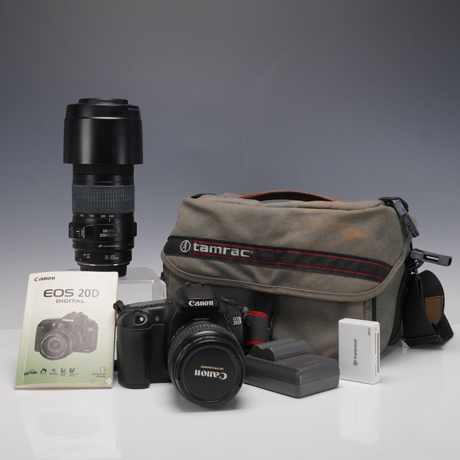 Canon EOS 20D DSLR Camera with 70-300 and 28-135mm Lenses, Case & Accessory: A Canon EOS 20D digital SLR camera kit with two Canon EF lenses and accessories. Included is a Canon EOS 20D DSLR body paired with a Canon EF 28-135mm f/3.5-5.6 IS USM lens, as well as a Canon EF 70-3
