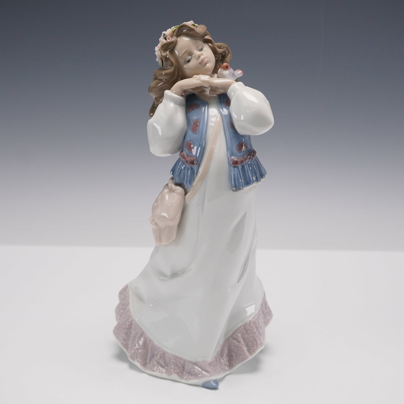 Lladro Figurine Dreams of a Summer Past 01006401: Lladro porcelain figurine titled Dreams of a Summer Past, item number 01006401. Designed by sculptor Francisco Polope and issued as the 1997 Lladro Event Figurine. Features a young girl in a flowing d