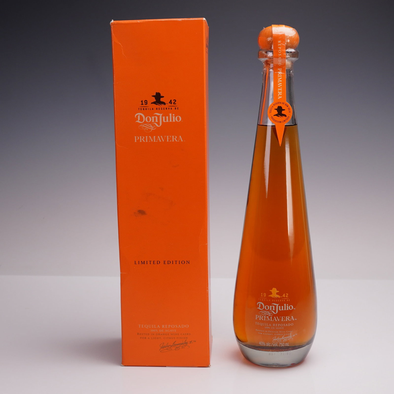 Don Julio Primavera Tequila Reposado Limited Edition 750ml: A limited edition bottle of Don Julio Primavera Tequila Reposado, presented in its signature tall orange bottle with matching box. This small-batch release is finished in orange wine casks to create a