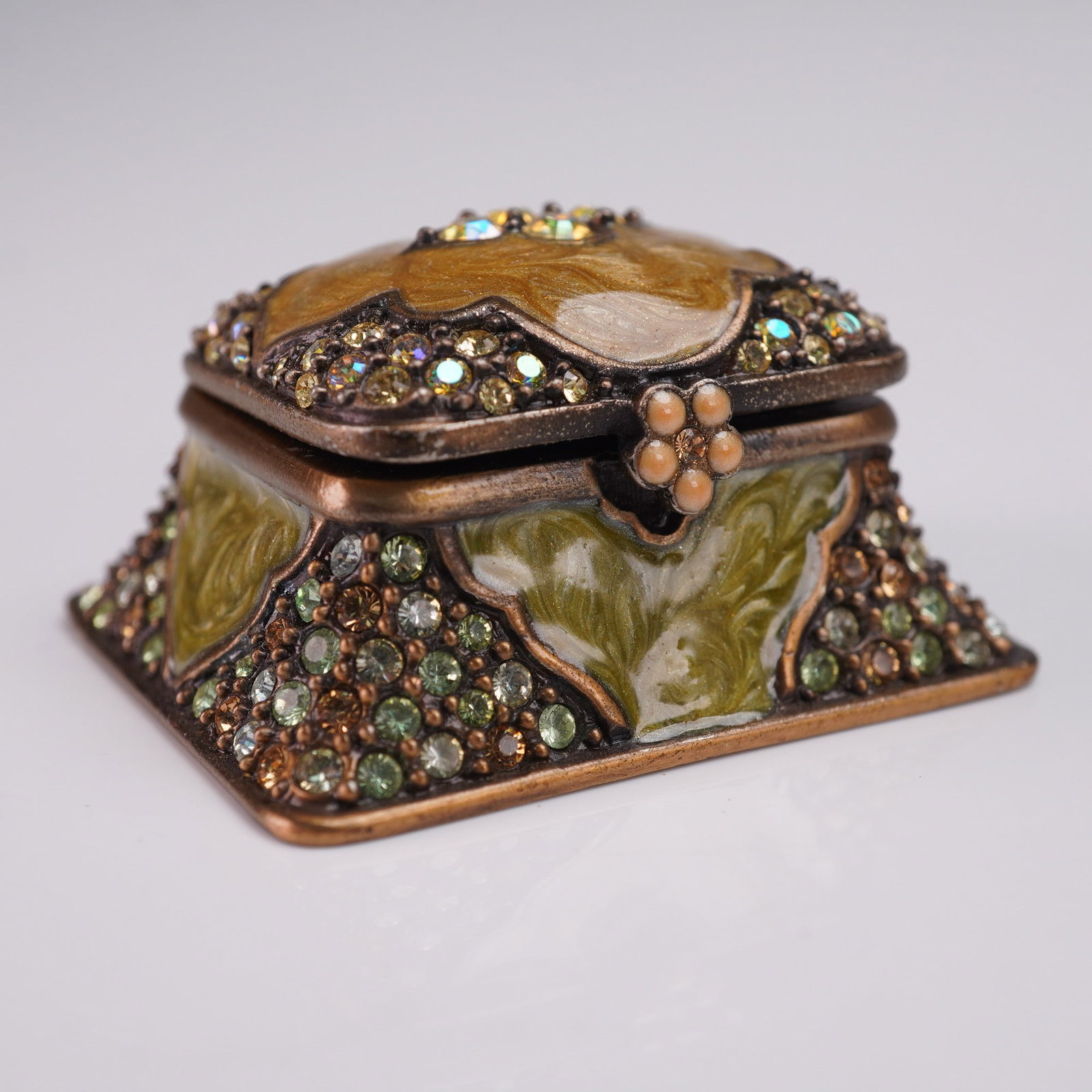 Jay Strongwater Treasure Box: Jay Strongwater treasure box featuring a pyramid form with hinged lid, decorated with hand-painted green and yellow enamel panels accented by clusters of faceted crystals in shades of amber, green, an