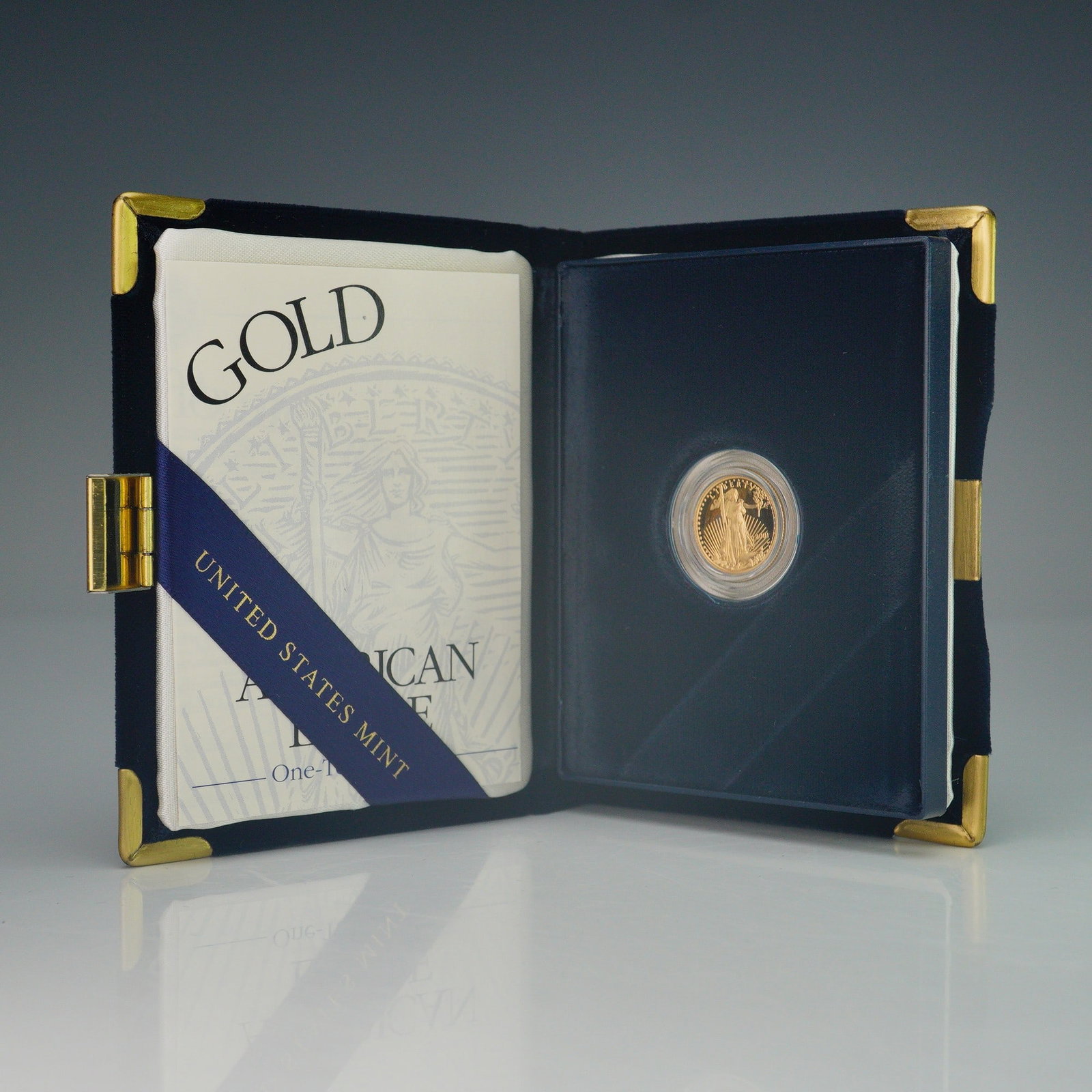 2001-W $5 American Gold Eagle 1/10 oz. Proof Coin: United States Mint 2001-W American Eagle one-tenth ounce gold proof coin, struck in 22-karat gold with a composition of 91.67% gold, 3% silver, and 5.33% copper. This proof specimen weighs 0.1091 troy