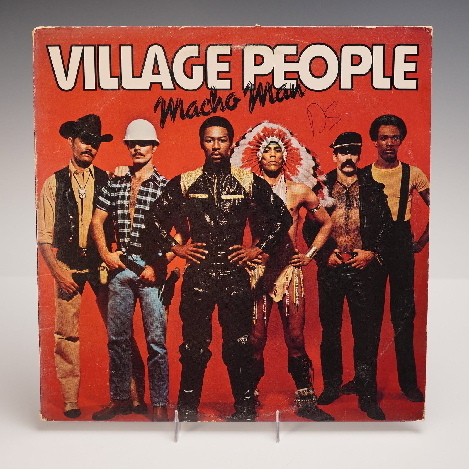 Casablanca Records Village People Vinyl Record, Macho Man: An original pressing of the Village People's 1978 album "Macho Man," released by Casablanca Records. The iconic cover features the full ensemble of costumed group members set against a bold red backgr