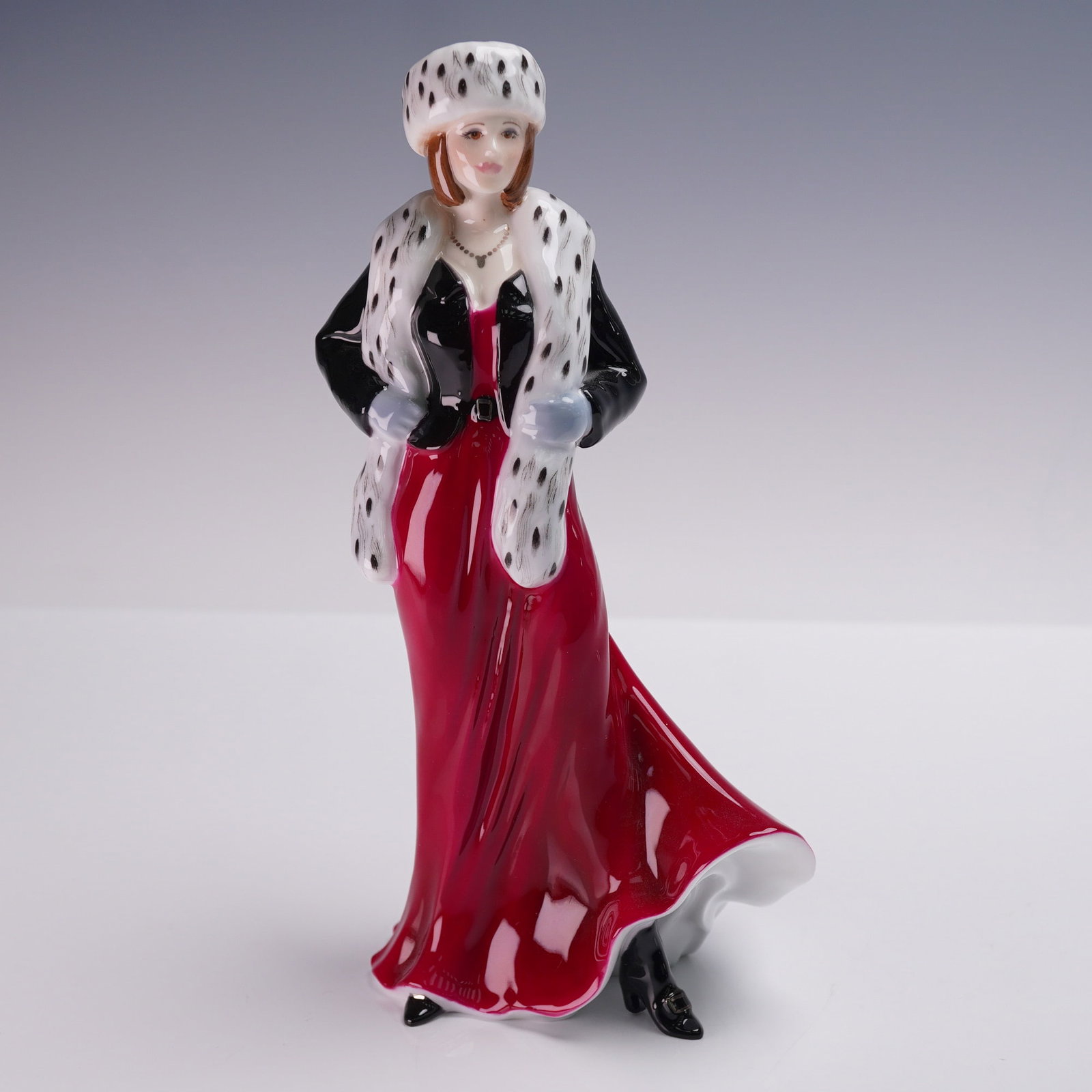 Royal Worcester Figurine, Alexandra Premiere 2004: Royal Worcester porcelain figurine titled Alexandra, from the Premiere 2004 collection. This elegant figure depicts a poised lady in a flowing crimson gown, black jacket, and ermine-trimmed hat and st