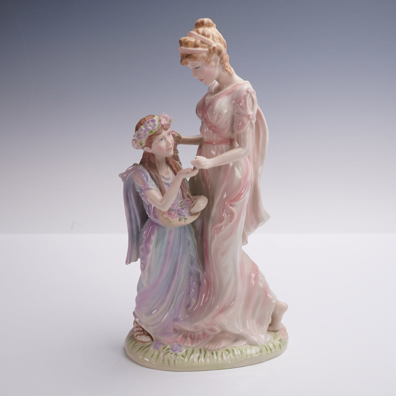 Wedgwood Porcelain Classical Collection Figurine, Tender Moments: A refined porcelain figurine from Wedgwood's Classical Collection (1996), titled Tender Moments and modeled by Jenny Oliver. This elegant piece depicts a classical mother and child in a gentle embrace