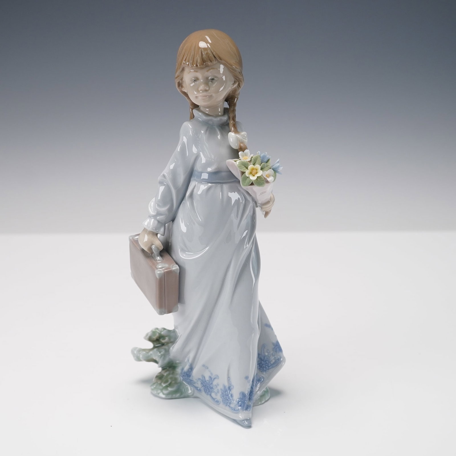 Lladro Porcelain Figurine, School Days 01007604: Lladro porcelain figurine 01007604, titled School Days, sculpted by Antonio Ramos. Issued and retired in 1988 as an exclusive release for the Lladro Collectors Society, this figurine captures a young 