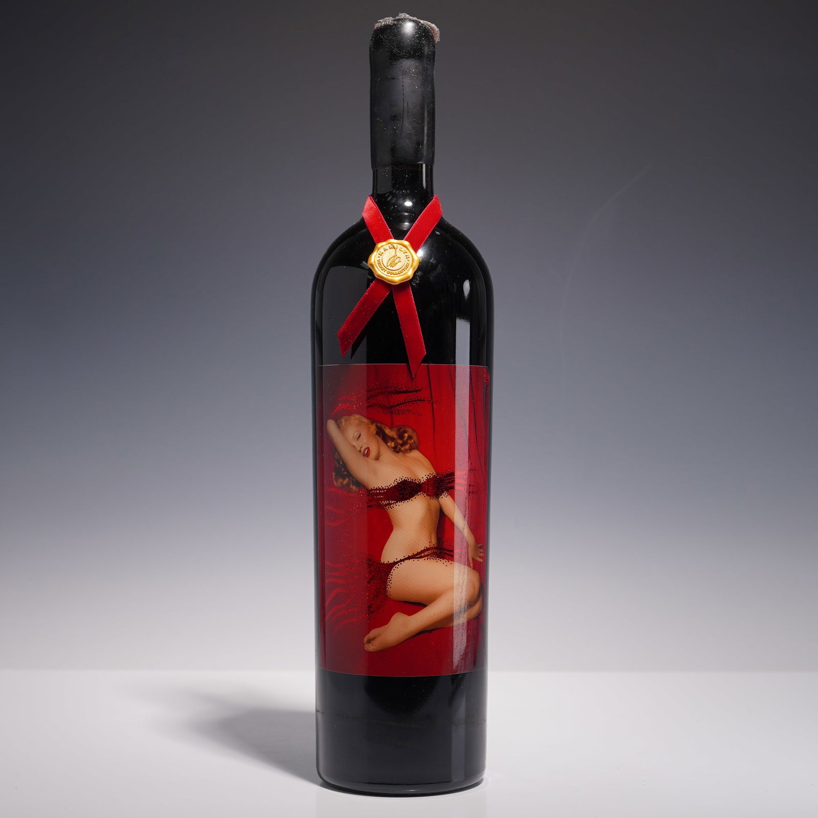 Marilyn Monroe Velvet Collection Napa Valley Magnum Wine, Vintage 2003: A striking 1.5 liter (magnum) bottle of Napa Valley red wine from the exclusive Marilyn Monroe Velvet Collection, vintage 2003. This collectible release is presented with a bold and glamorous label fe