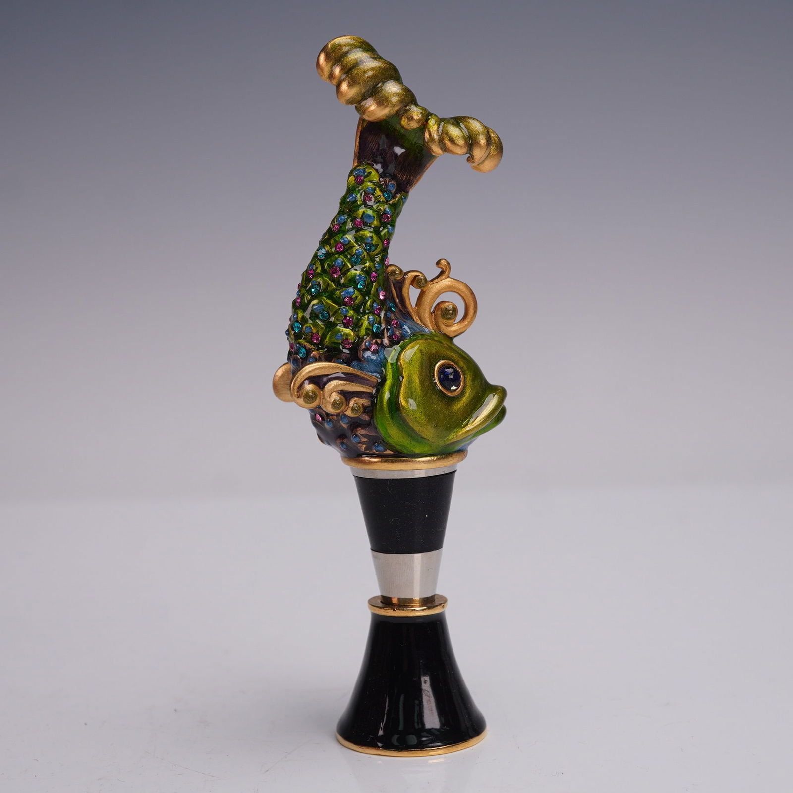 Jay Strongwater Wine Stopper, Koi Fish: Jay Strongwater wine stopper featuring a colorful koi fish design, embellished with multicolored crystals and finished in vibrant enamel with gold-tone accents. The koi fish is mounted on a tapered bl