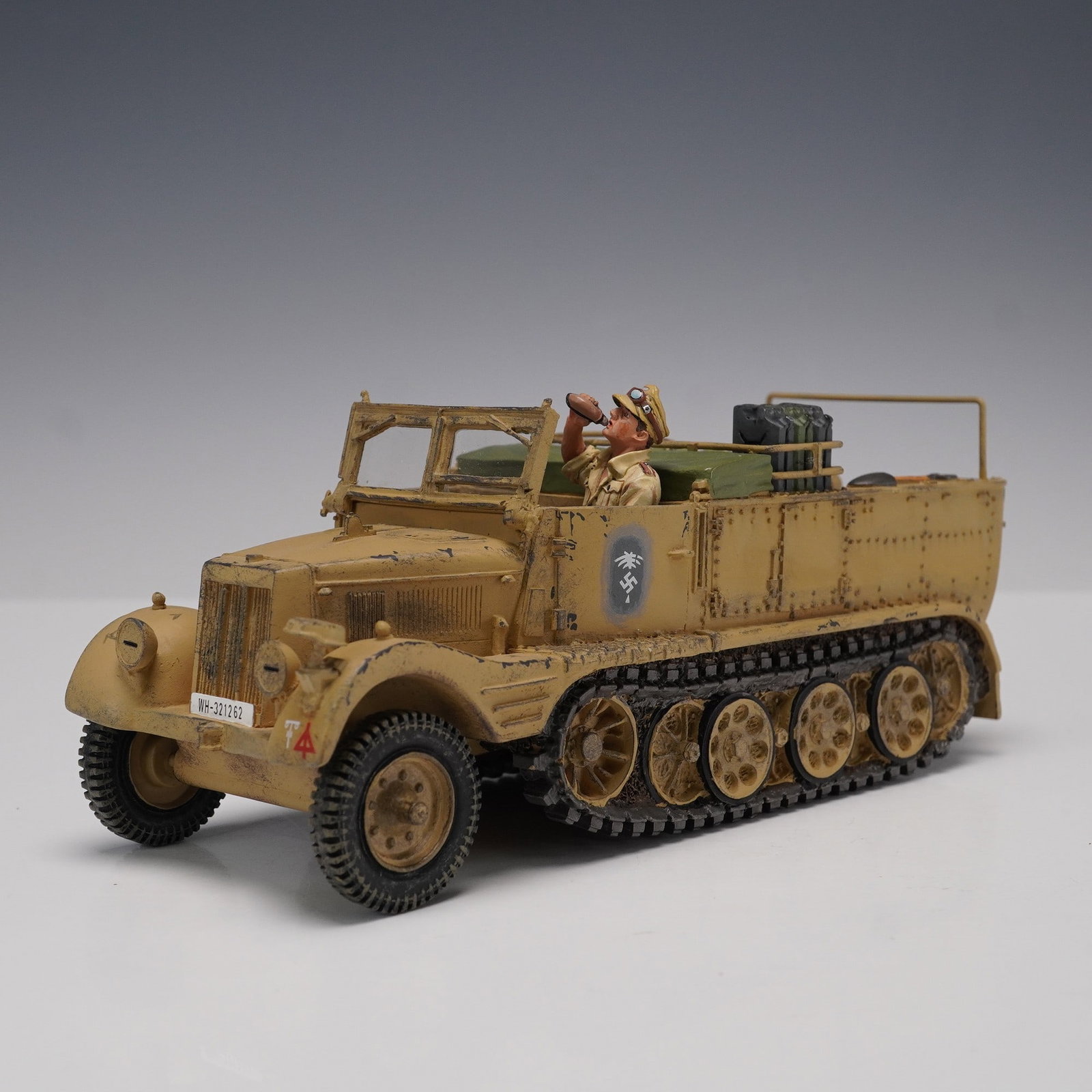 King & Country Sd.Kfz.11 Half-Track, Leichte Zugkraftwagen 3t Model: Detailed 1:30 scale model by King & Country of the German Sd.Kfz.11 half-track, Leichte Zugkraftwagen 3t, finished in a North African desert camouflage scheme. The model features realistic wear and we