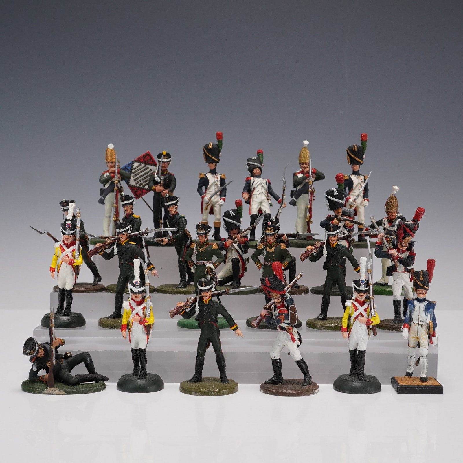 25pc Napoleonic-Era Painted Military Figurines: An assorted 25-piece group of hand-painted Napoleonic-era military miniatures depicting soldiers from various European armies. The set includes figures in colorful period uniforms, with shakos, bearsk
