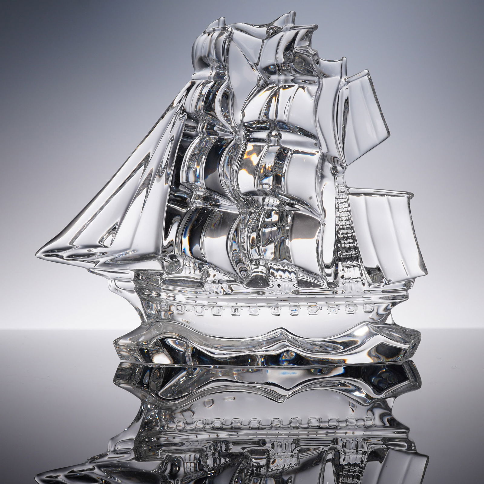 Waterford Crystal Tall Ship Sculpture: A finely crafted lead crystal sculpture titled Tall Ship by Waterford. This clear Irish crystal figure depicts a fully-rigged sailing vessel in full sail, complete with detailed masts and rigging, mol
