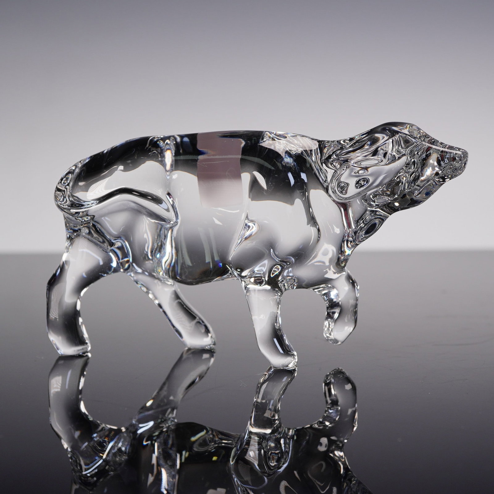 Baccarat Crystal Ox Figurine with Original Box: Elegant Baccarat crystal figurine depicting an ox in a walking stance, crafted with the brand's signature clarity and precision detailing. The sculpture captures the strength and grace of the animal t