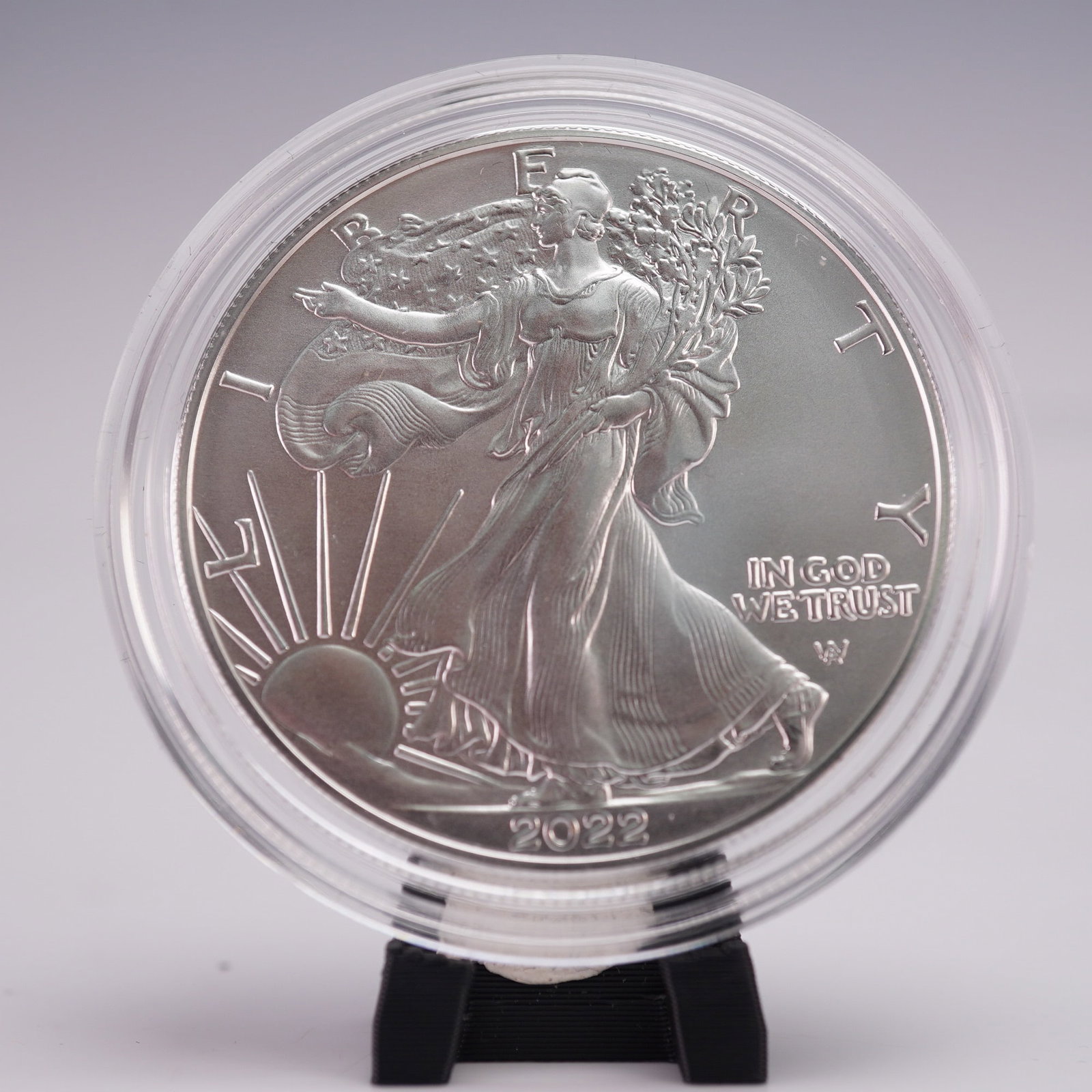 2022-W US 1oz Silver Eagle (T-2) UNC Coin OGP: One ounce .999 fine silver uncirculated coin minted by the United States Mint in 2022. The obverse features Liberty in full stride, draped in the American flag, her right hand extended, and branches o