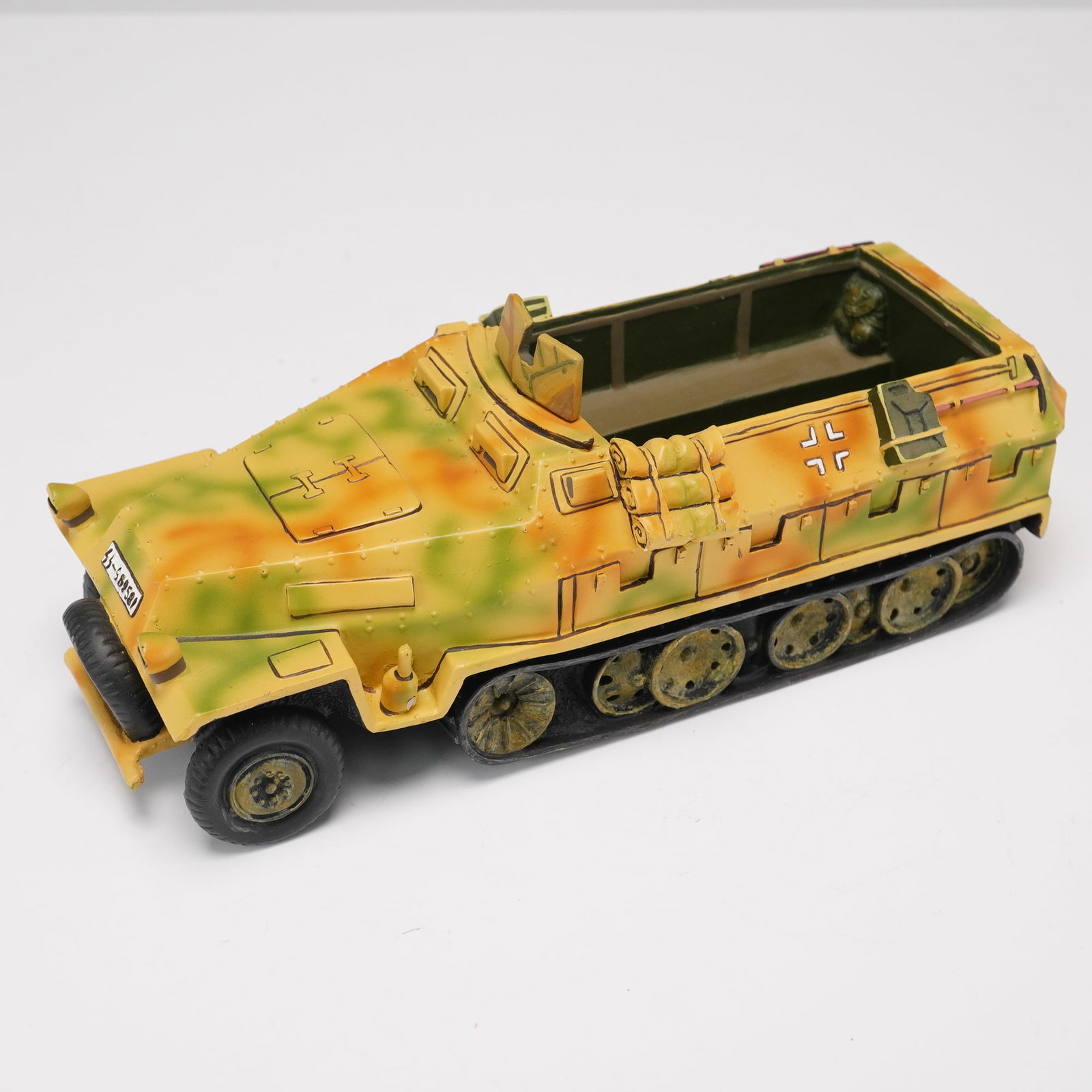 King & Country 1:30 Scale Waffen SS Sd.Kfz. 251 Half-Track Model: Detailed and impressively painted, this King & Country armored vehicle replicates the iconic German Sd.Kfz. 251 half-track in striking tri-color camouflage. The model is marked "Waffen SS" and dated 1