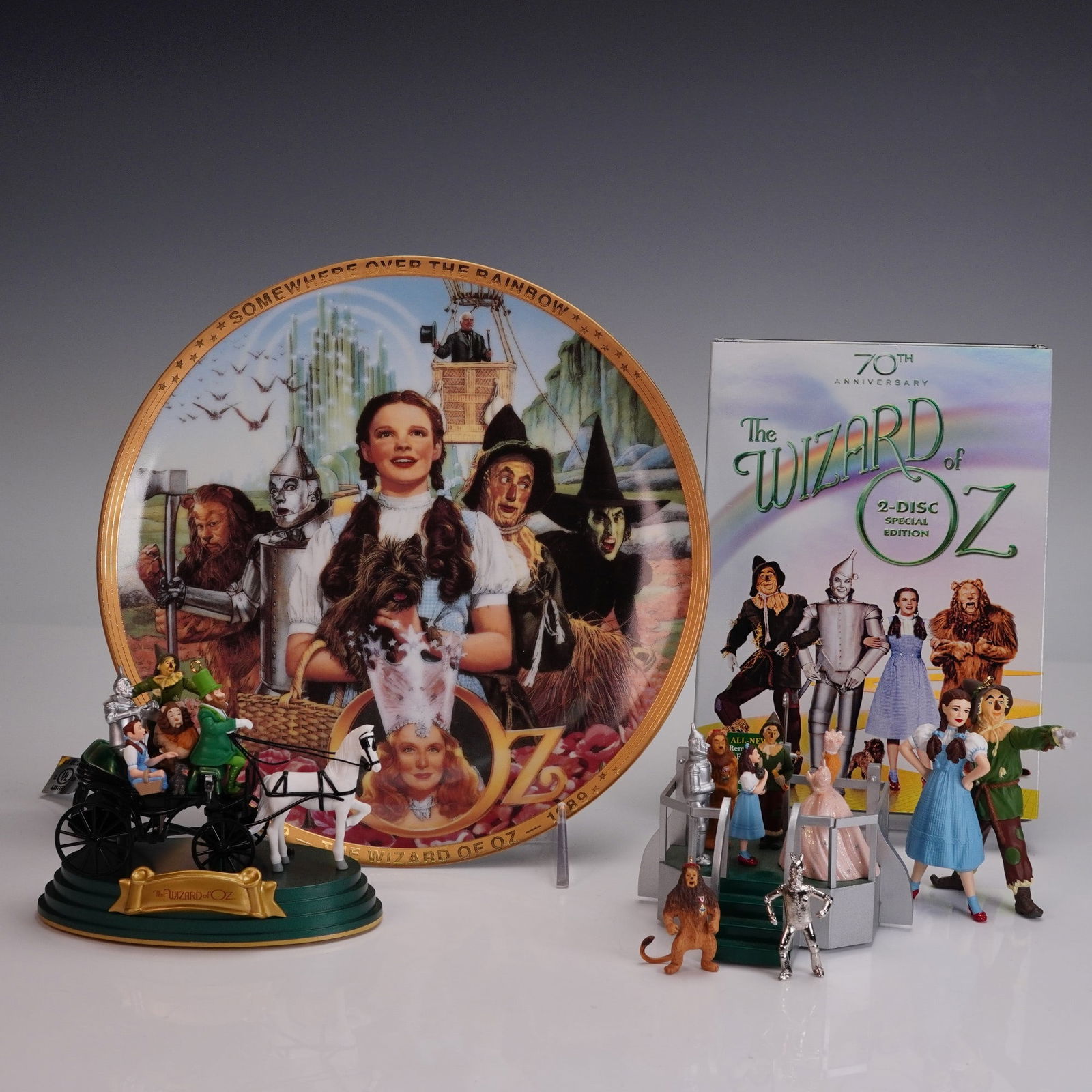 7pc Wizard of Oz DVD, Ornaments, and Wall Plate: A charming collection of 7 Wizard of Oz themed treasures featuring a colorful 50 Years of Oz plate from the Hamilton Collection decorated with bright character portraits and a sealed 70th anniversary