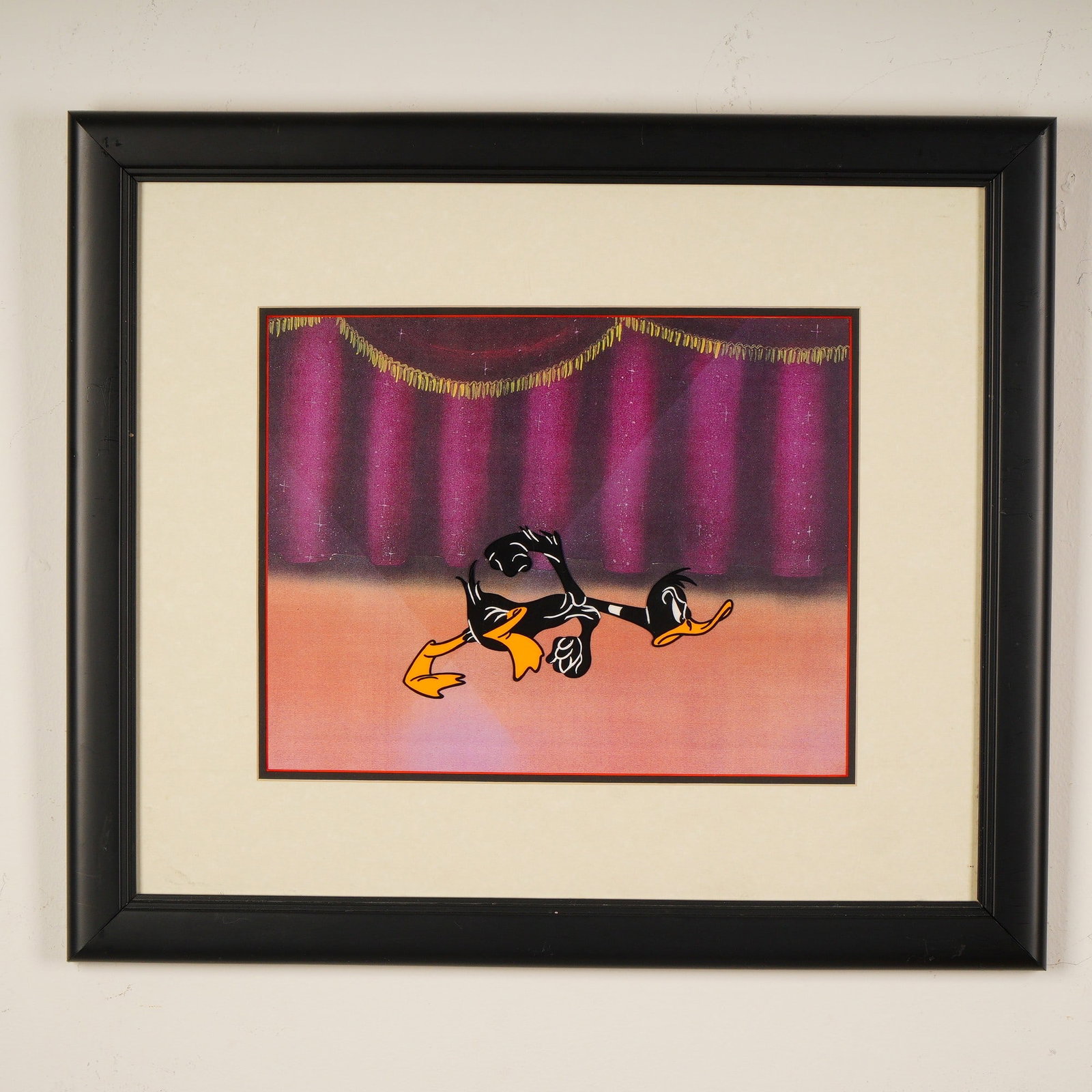 Warner Bros. Looney Tunes Daffy Duck Original Animation Cel w/ COA: A vibrant hand-painted contemporary animation cel featuring the iconic Warner Bros. character Daffy Duck in a comedic theatrical pose. The cel depicts Daffy seemingly flopped on the stage floor beneat