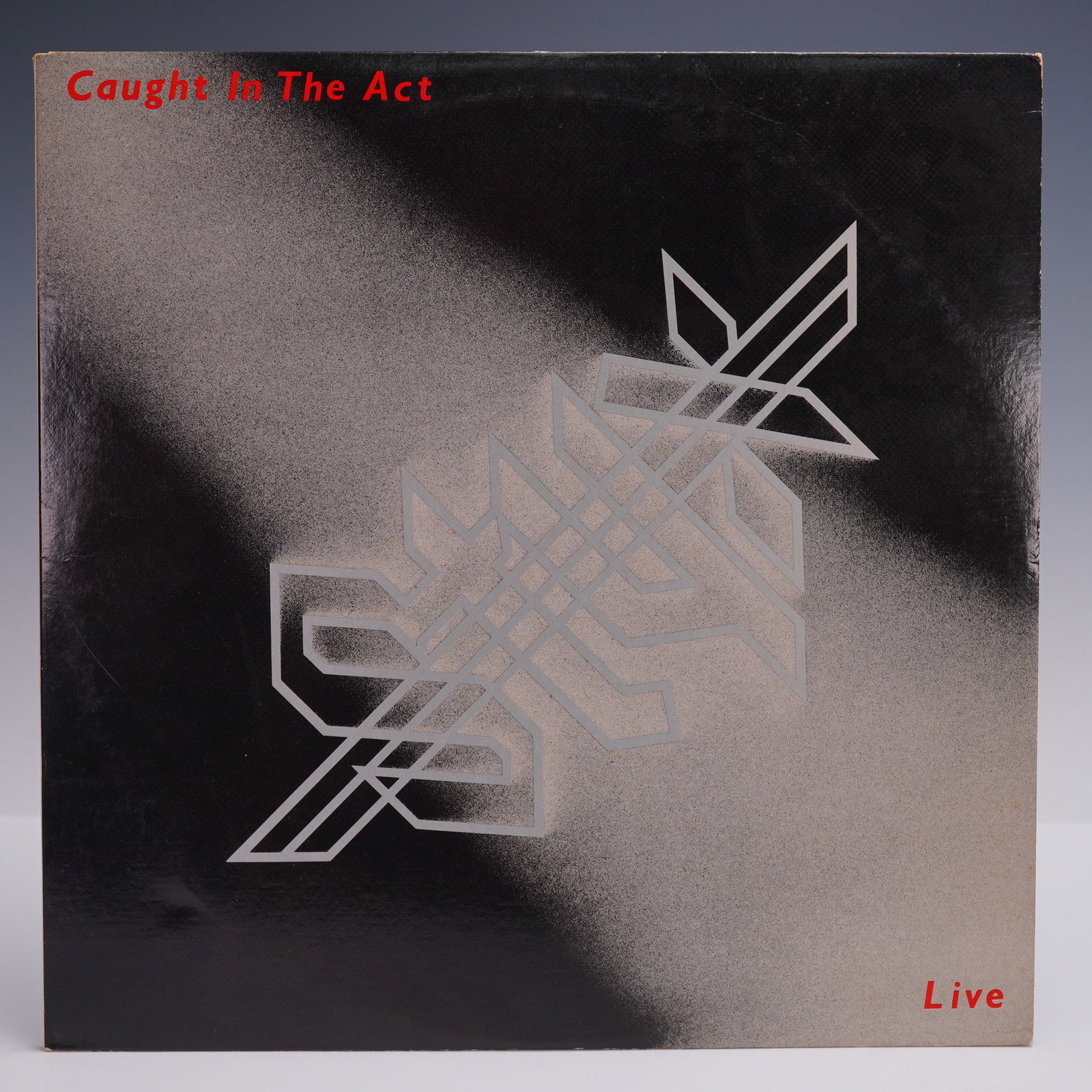 Styx Caught in the Act - Live Double LP Record: Gatefold album featuring a live performance from the iconic American rock band, with photo collage inner spread. Includes tracks like "Mr. Roboto," "Too Much Time on My Hands," "Babe," and "Come Sail