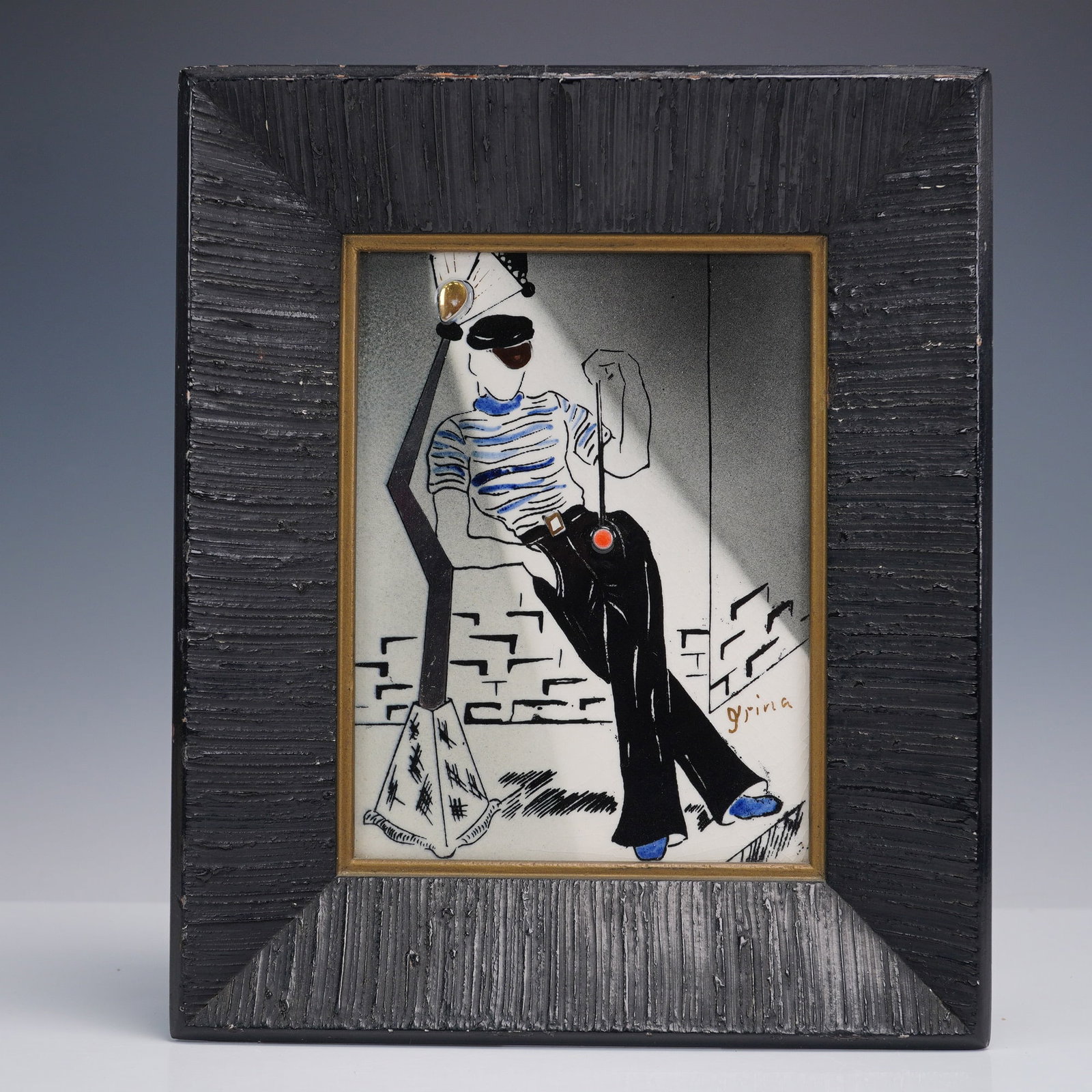 Framed Irina Lorin Streetlight Figure Tile Artwork: Framed painted ceramic tile signed Irina Lorin, featuring a stylized male figure in sunglasses and a striped shirt leaning against a modernist streetlamp. The tile surface is painted or underglazed wi