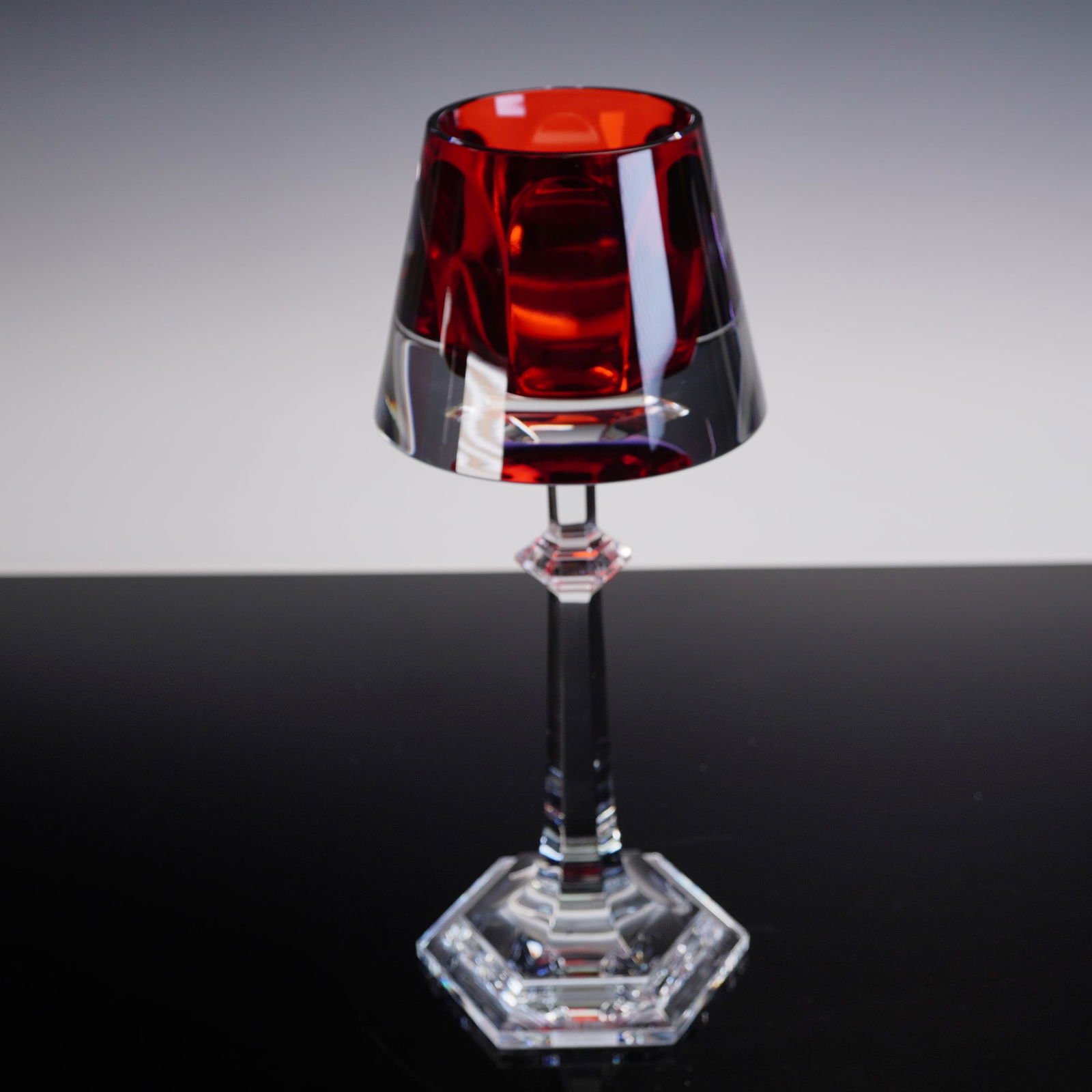 Baccarat Harcourt My Fire Red Candlestick: Baccarat crystal Harcourt My Fire candlestick in vibrant red, designed by acclaimed French designer Philippe Starck. This contemporary reinterpretation of Baccarat's legendary Harcourt glassware featu