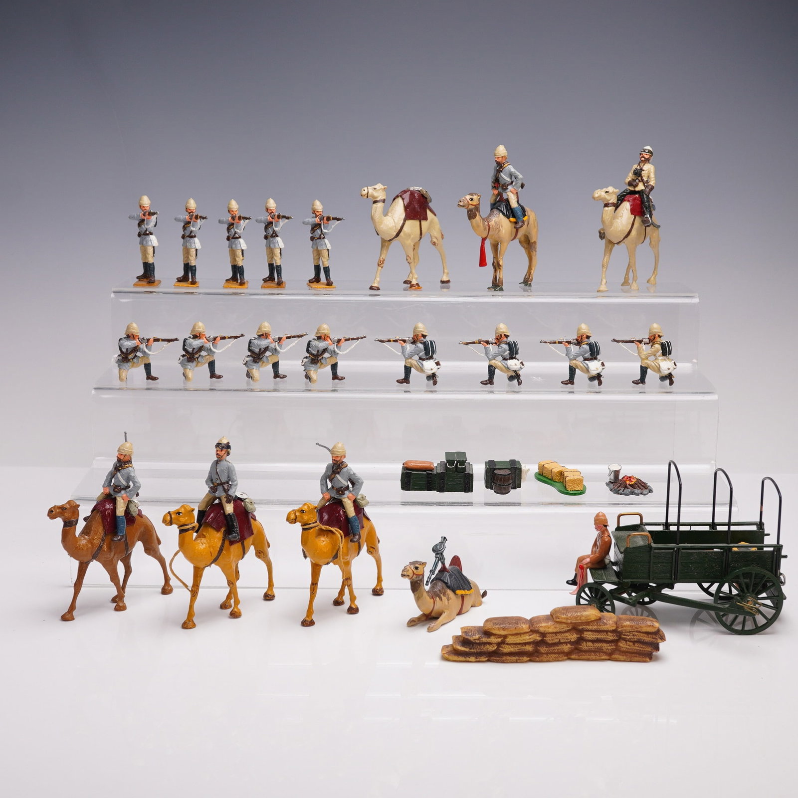 33pc British Colonial Camel Corps Miniature Figurines: Collection of thirty-three hand-painted miniature figures depicting British colonial troops, modeled after the historical Camel Corps units used during late 19th-century desert campaigns, such as thos