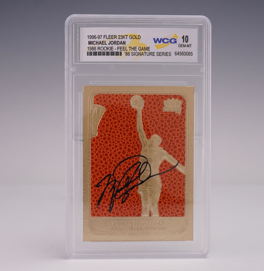 1996-97 Fleer 86 Signature Series MJ 23Kt Gold Card WCG Gem Mint 10: This 1996-97 Fleer 86 Signature Series Feel The Game Michael Jordan card is finished in 23 karat gold foil and graded Gem Mint 10 by WCG (World Class Grading). The design pays tribute to the iconic 19
