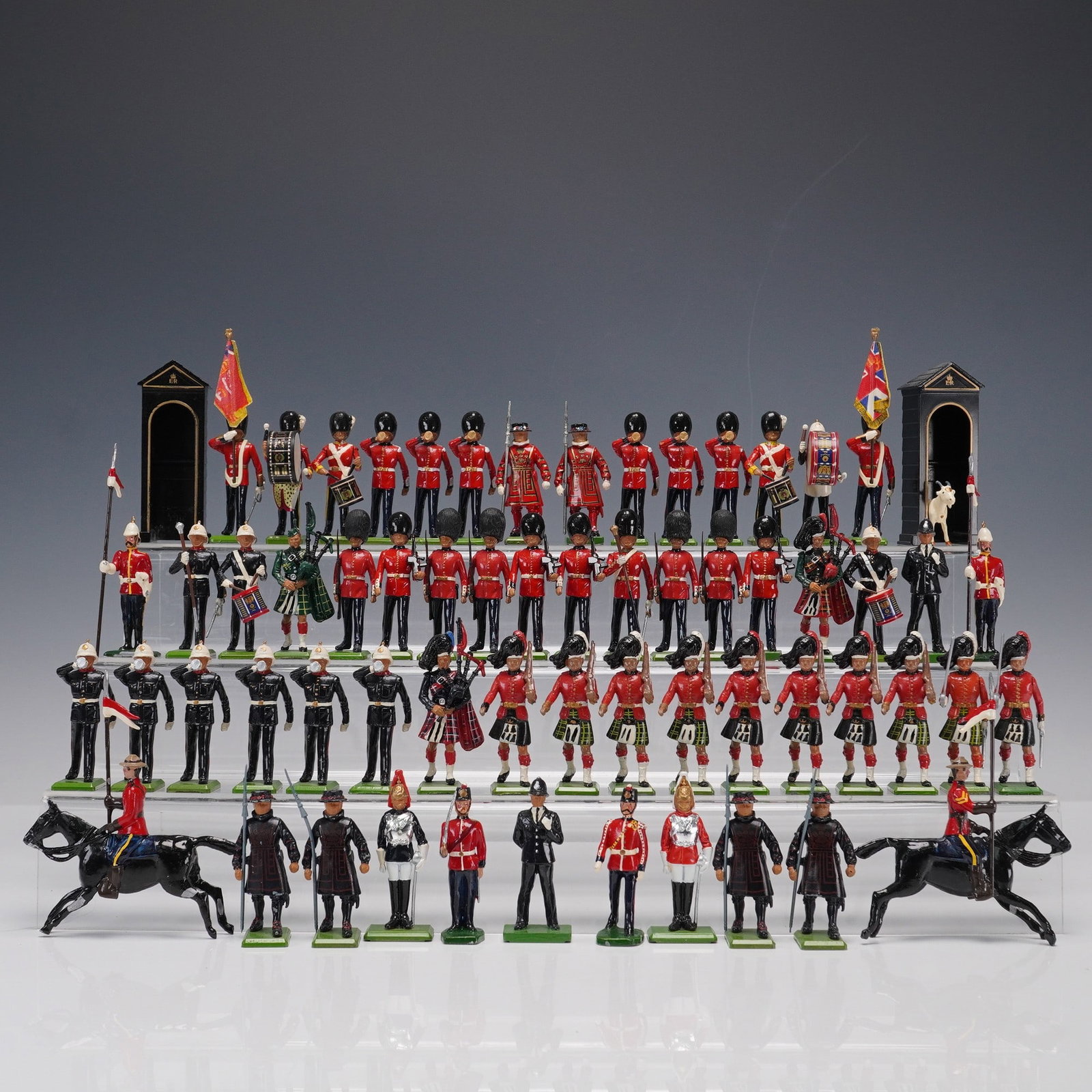 28pc Napoleonic-Era Painted Figurines: A 28-piece assortment of hand-painted Napoleonic-era military figurines, with maker markings including Grenadier and Almirall Palou. The lot features line infantry, officers, flag bearers, and wounded