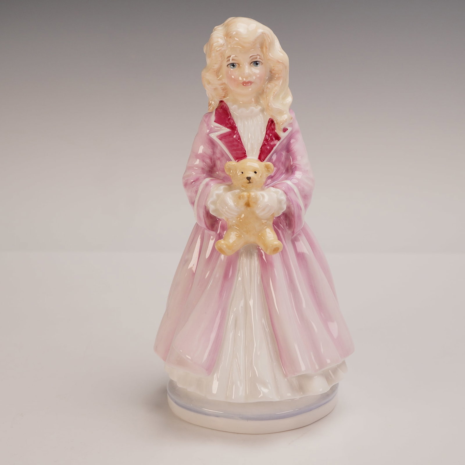 Royal Doulton Figurine Faith HN3082: Royal Doulton porcelain figurine titled Faith HN3082, commissioned by Lawleys by Post in collaboration with the National Society for the Prevention of Cruelty to Children (NSPCC). Designed by Eric J. 