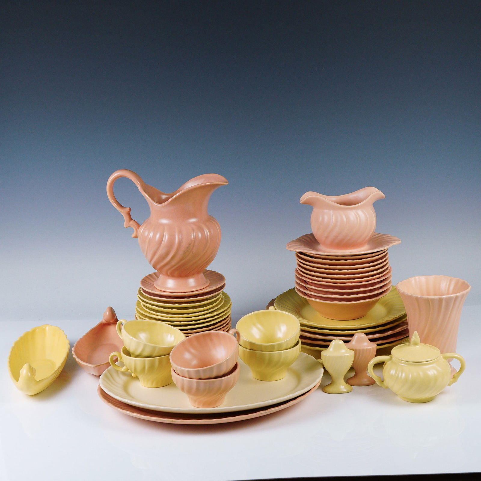 47pc Vintage Franciscan Coronado Matte Pastel Dinnerware Set: Step into mid-century charm with this beautifully curated 47-piece set of Franciscan Coronado dinnerware, crafted in California by the renowned Gladding, McBean & Co. This vintage collection features