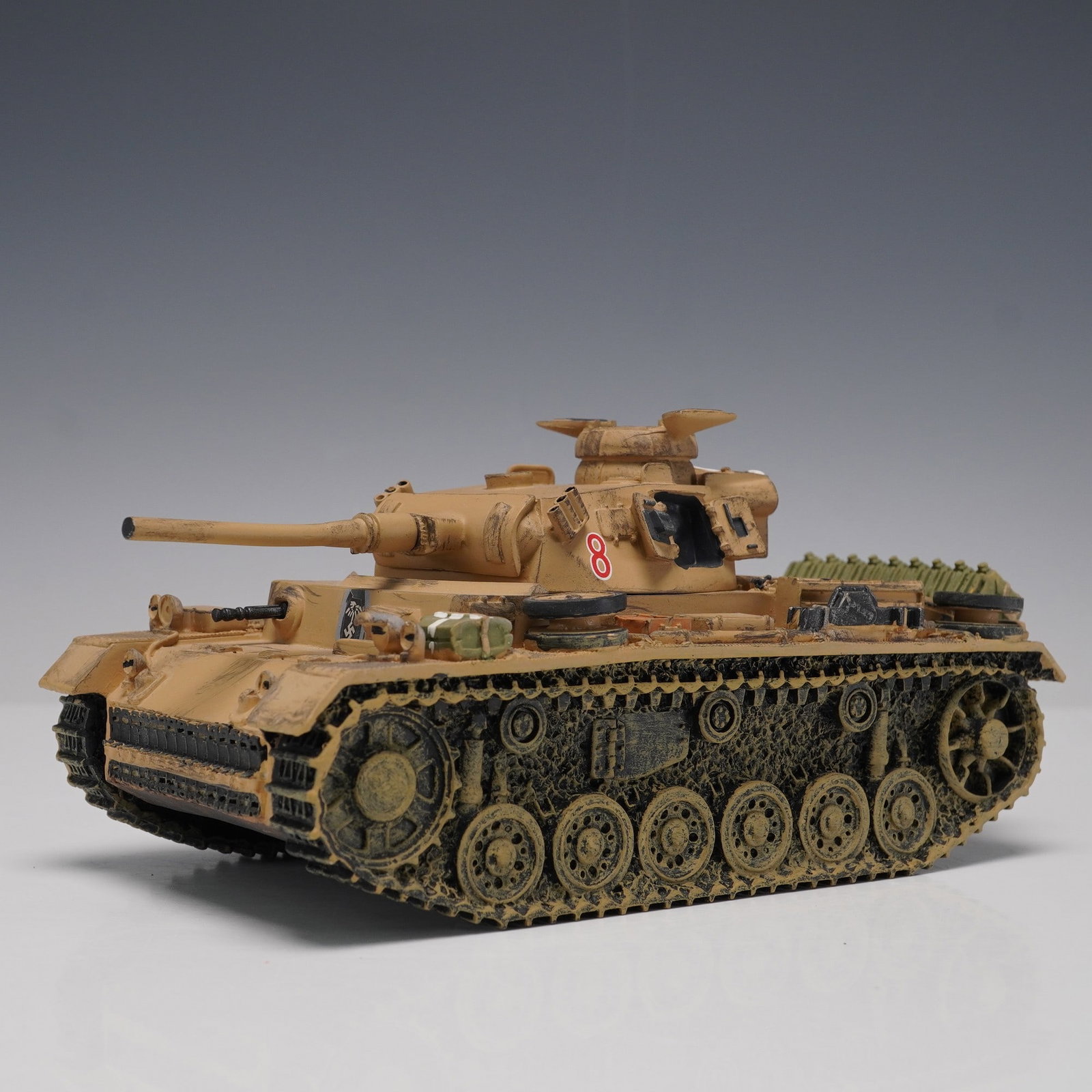 King & Country Panzer III Model Tank: King & Country die-cast military model, Panzer III tank, dated 2002. Highly detailed in desert tan camouflage with molded accessories including spare treads, jerry cans, and gear, and featuring a fabr