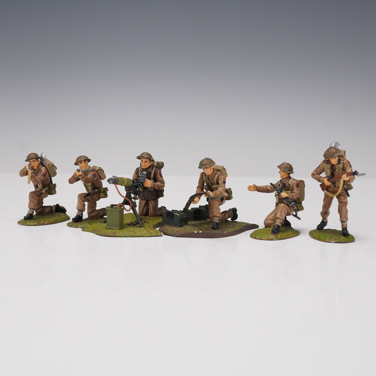 6pc Frontline Figures, WWII British Infantry Miniatures: A set of six hand-painted metal military miniatures by Frontline Figures, depicting British infantry soldiers in combat poses from World War II. The grouping includes a range of detailed figures, such