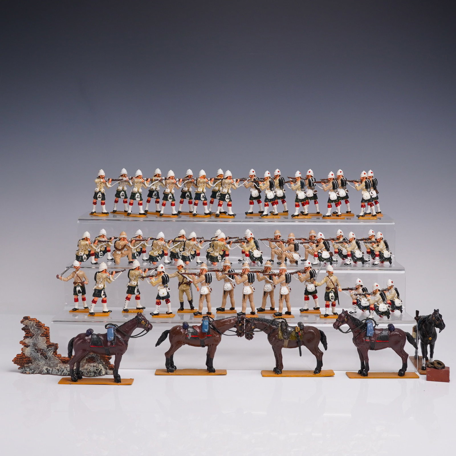 59pc Painted Toy Soldiers, El Templario Colonial Soldiers and Horses: 59 hand-painted metal toy soldiers by El Templario, marked ET and Coleccion El Templario on the bases. Depicts a regiment in khaki tunics, red and white socks, and pith helmets, posed in various rifle