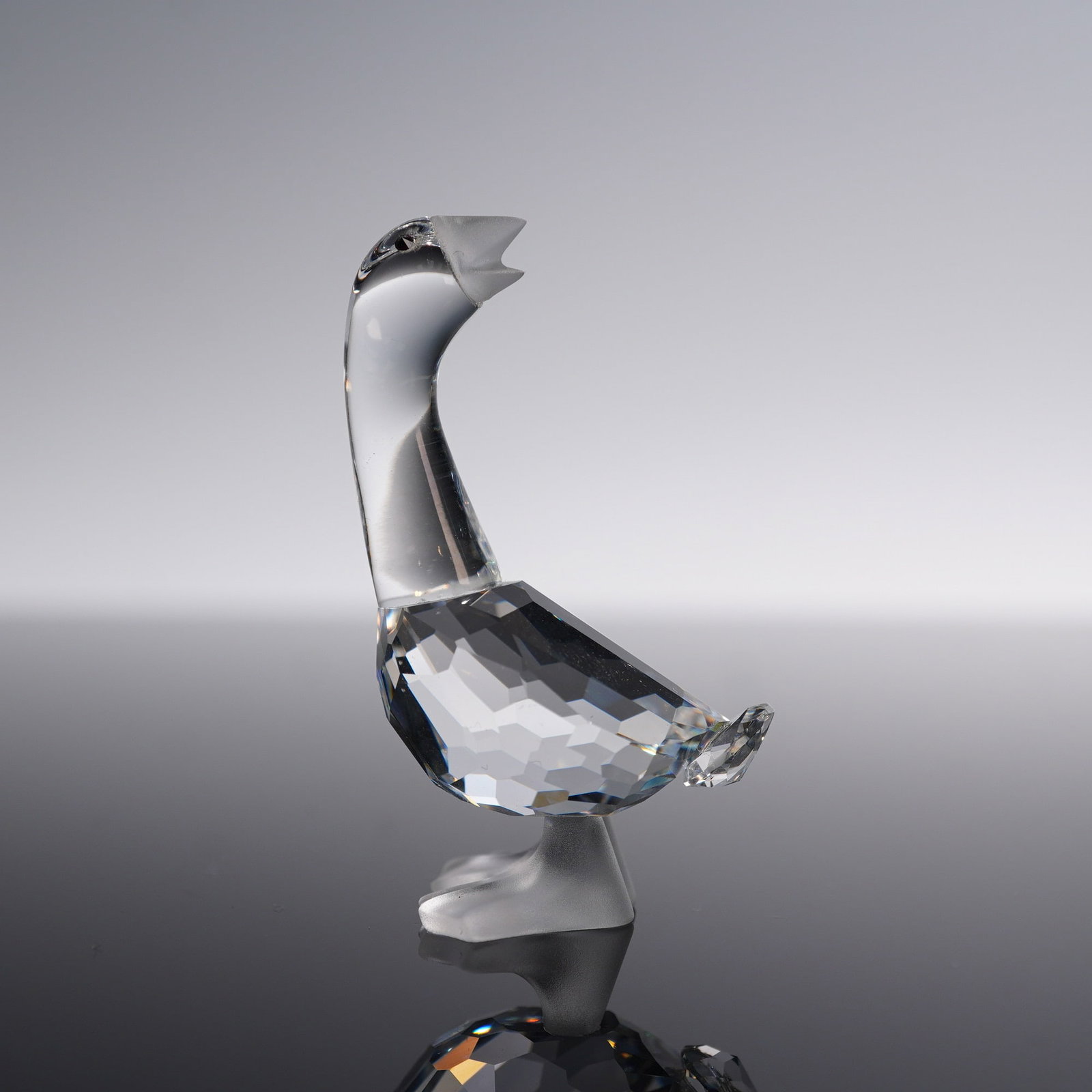 Swarovski Crystal Figurine, Goose Mother: Swarovski Silver Crystal figurine titled Goose Mother, featuring a clear faceted crystal body with a frosted beak and feet. Part of the Silver Crystal collection, this charming piece was crafted in Au