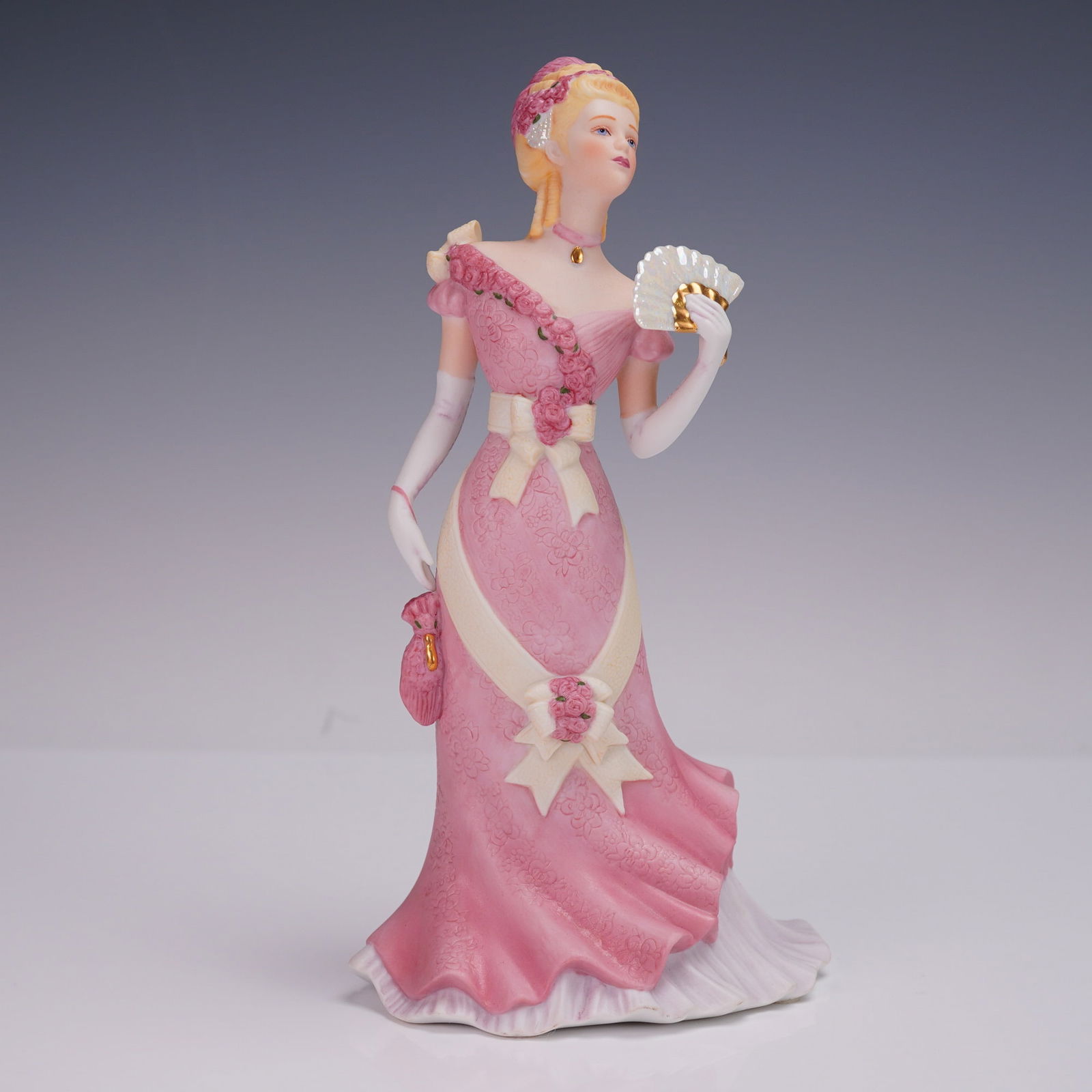 Lenox "Royal Reception" Limited Anniversary Edition Porcelain Figurine: A graceful Lenox "Royal Reception" fine porcelain sculpture, part of their Limited Anniversary Edition collection. Standing approximately 9 inches high, this exquisitely detailed figurine portrays a p