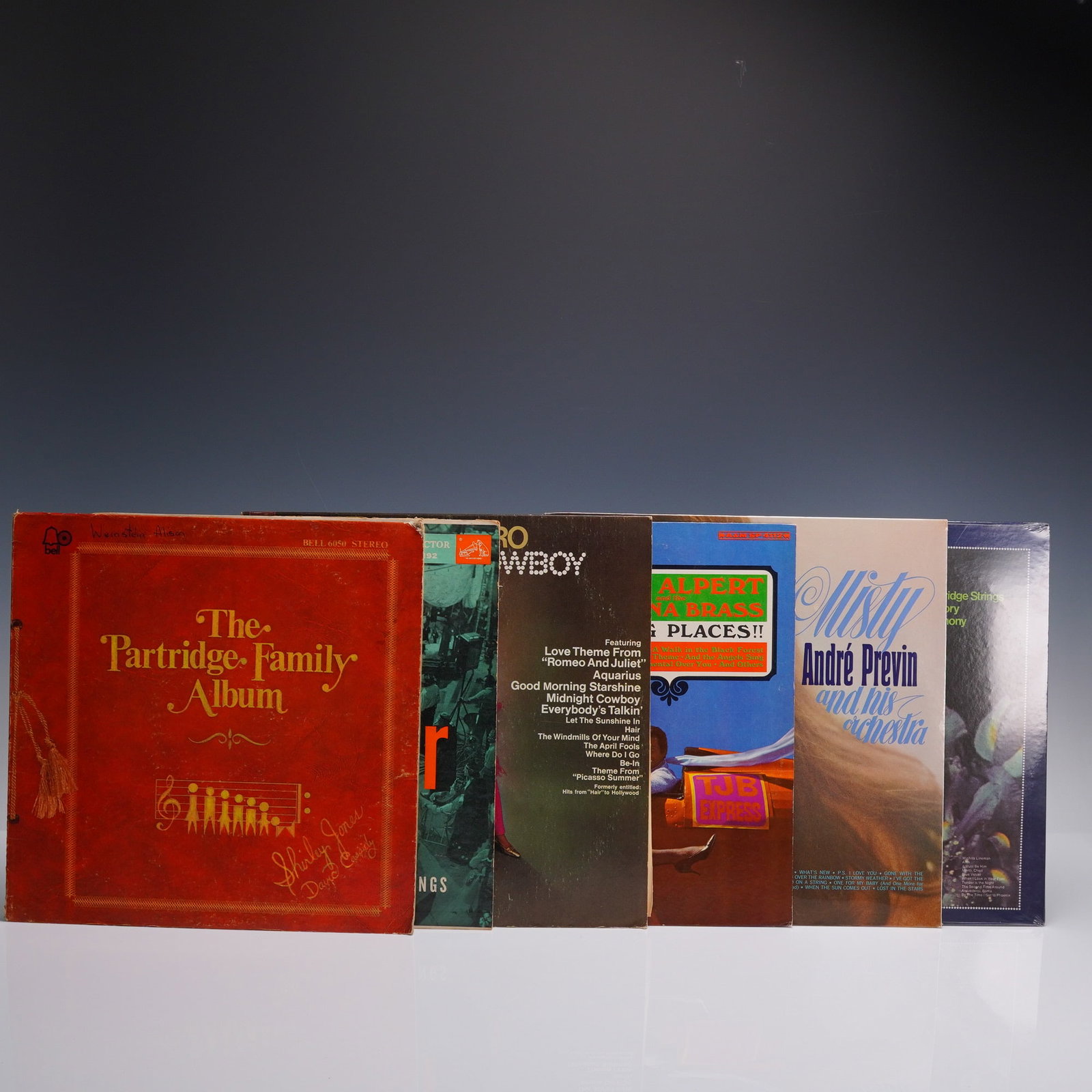 6pc Lounge and Pop Vinyl LPs: 6 vintage vinyl LPs featuring mellow hits, soft pop, and easy listening classics. Includes artists and titles such as the Partridge Family Album, Glenn Miller original recordings, Peter Nero Midnight 