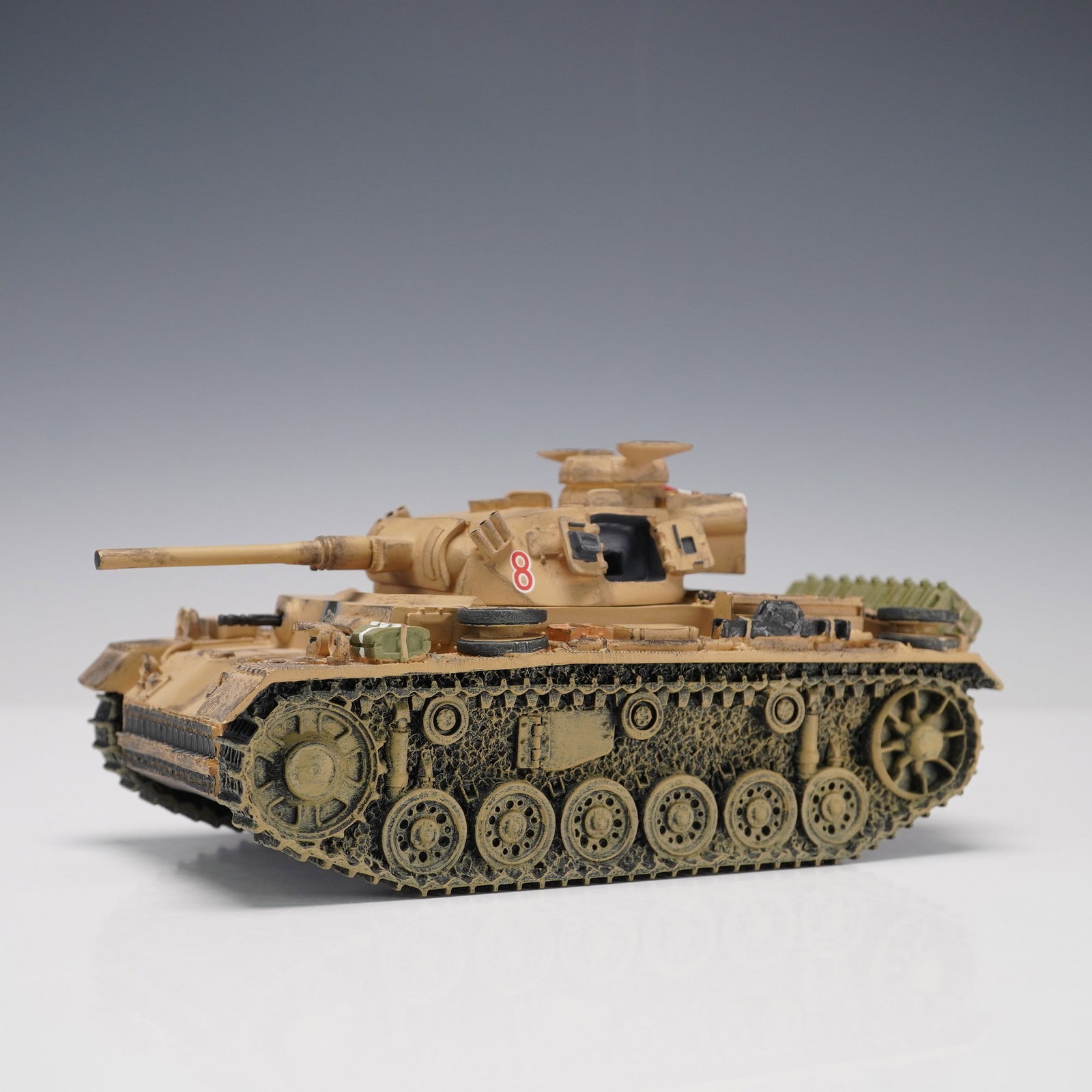 King & Country Panzer III Tank Model: Detailed King & Country die-cast model of a Panzer III tank, hand-painted in desert camouflage and marked with the number 8 on the turret. This 2002 edition captures the armored precision of Germany's