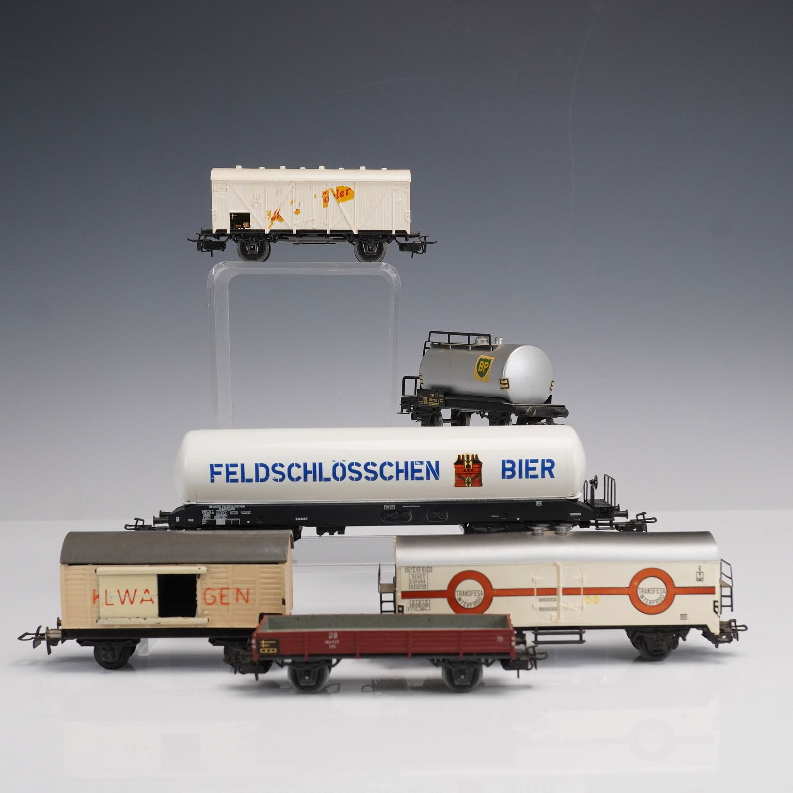 6pc Marklin Model Train Freight Cars: Group of six Marklin model train freight cars, all marked Made in Western Germany, including a Feldschlosschen Bier tanker, BP fuel tanker, Transfer tank car, Elwagen boxcar, white Ventil boxcar, and